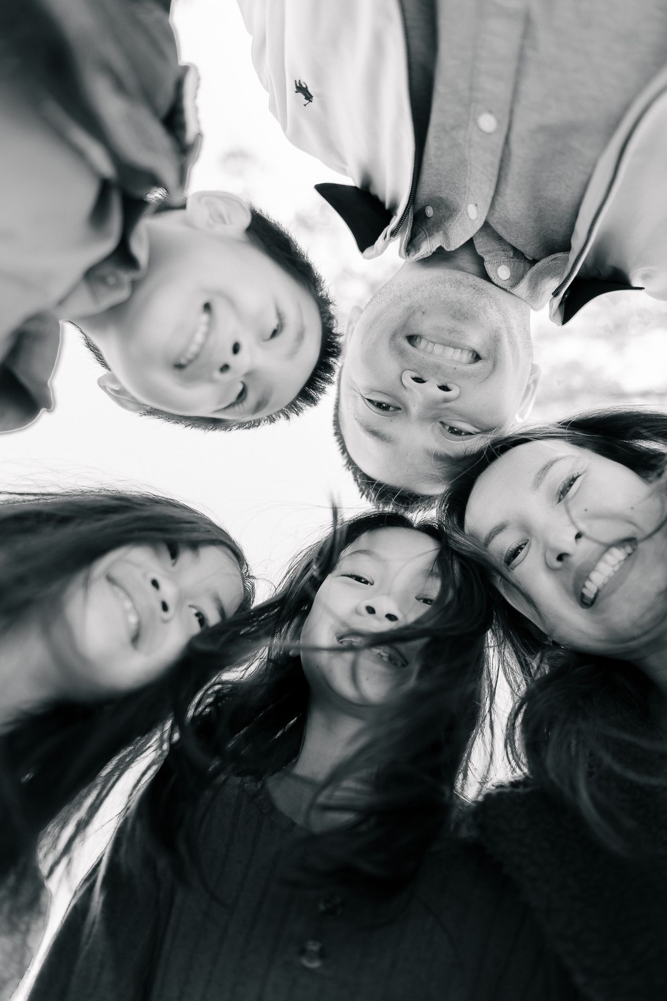 A series of black and white selfie photos showing people posing together and smiling at the camera.