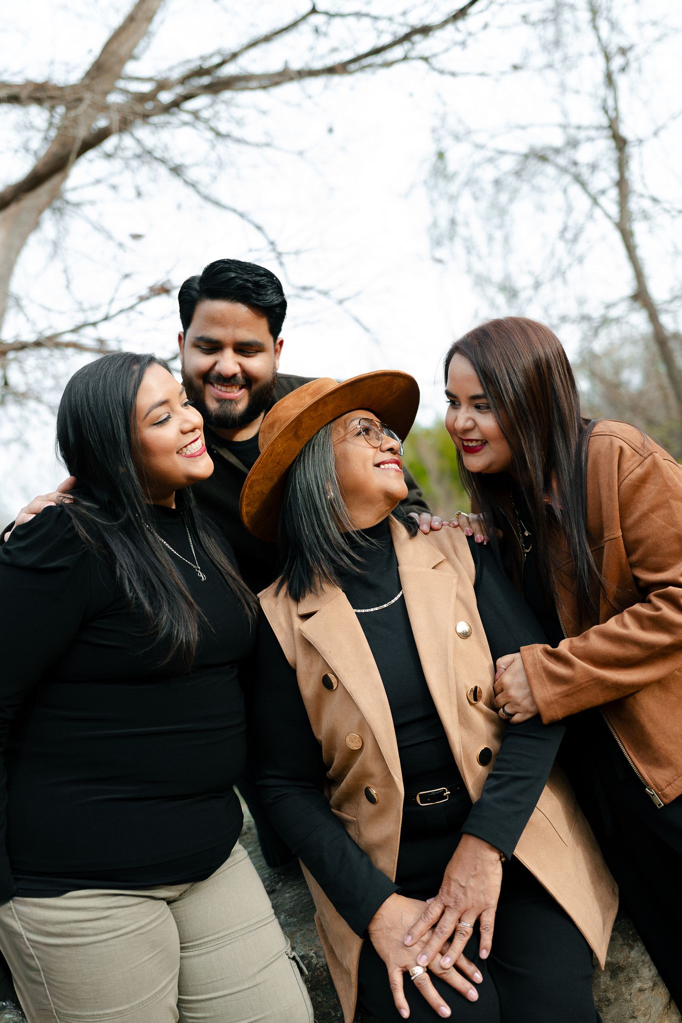 A series of candid moments showing two people in casual attire laughing and embracing outdoors on a winter day.