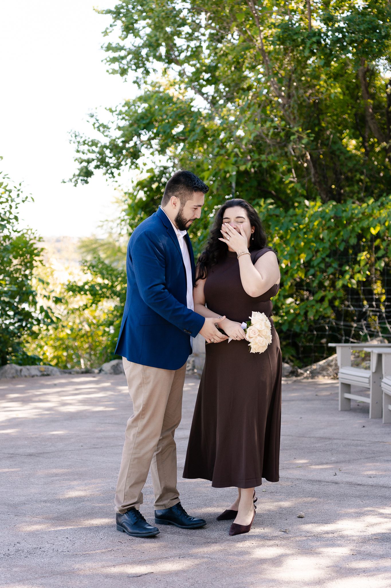 A couple shares a romantic moment in a series of four photos taken outdoors with trees in the background.