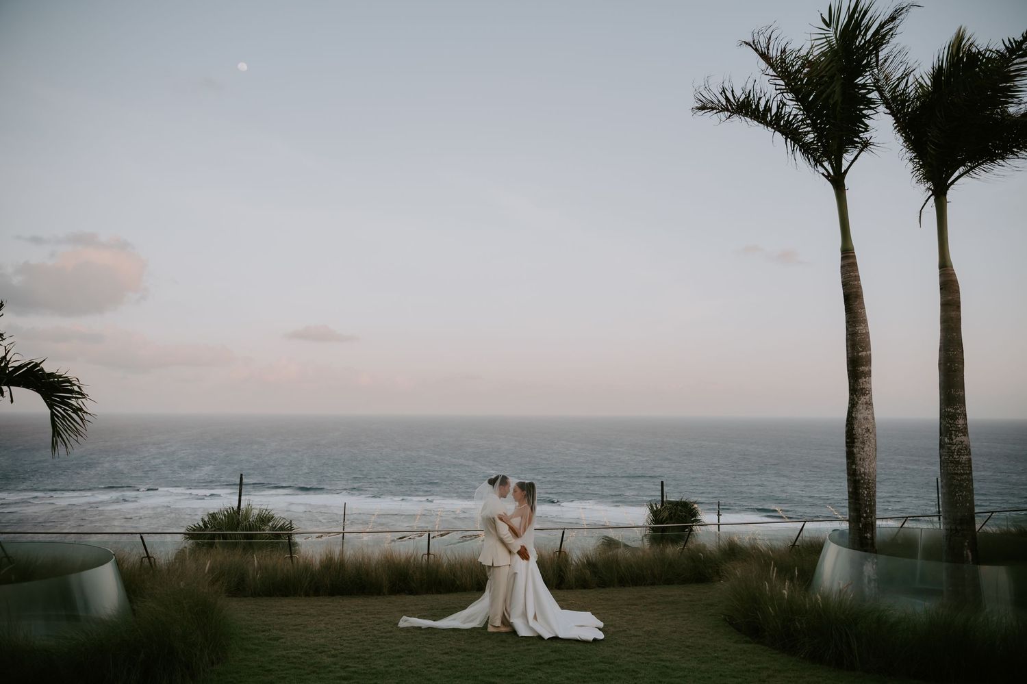 A series of romantic beach wedding photos showing palm trees and ocean views at sunset.