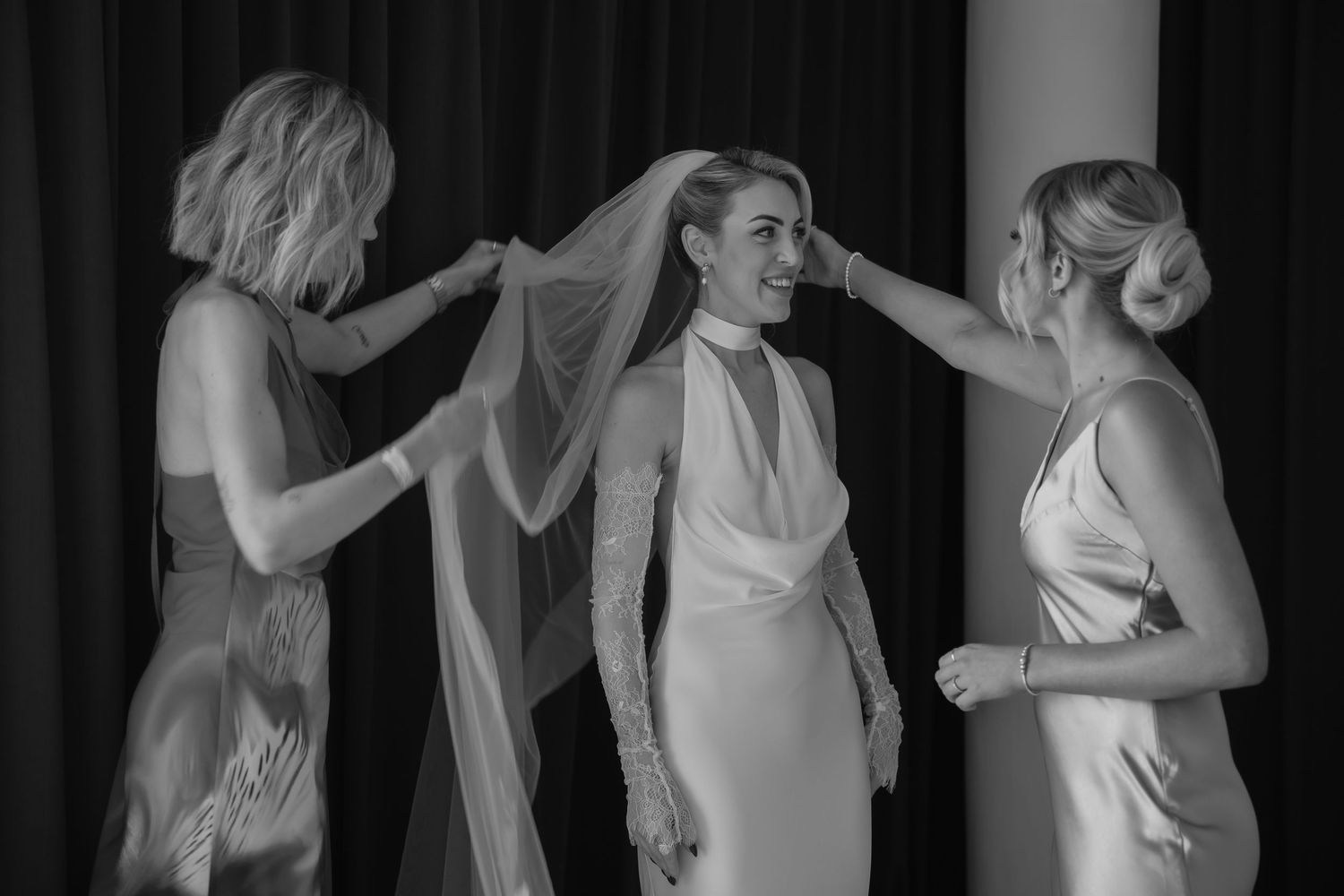 Intimate getting ready moments captured in black and white during wedding preparations.