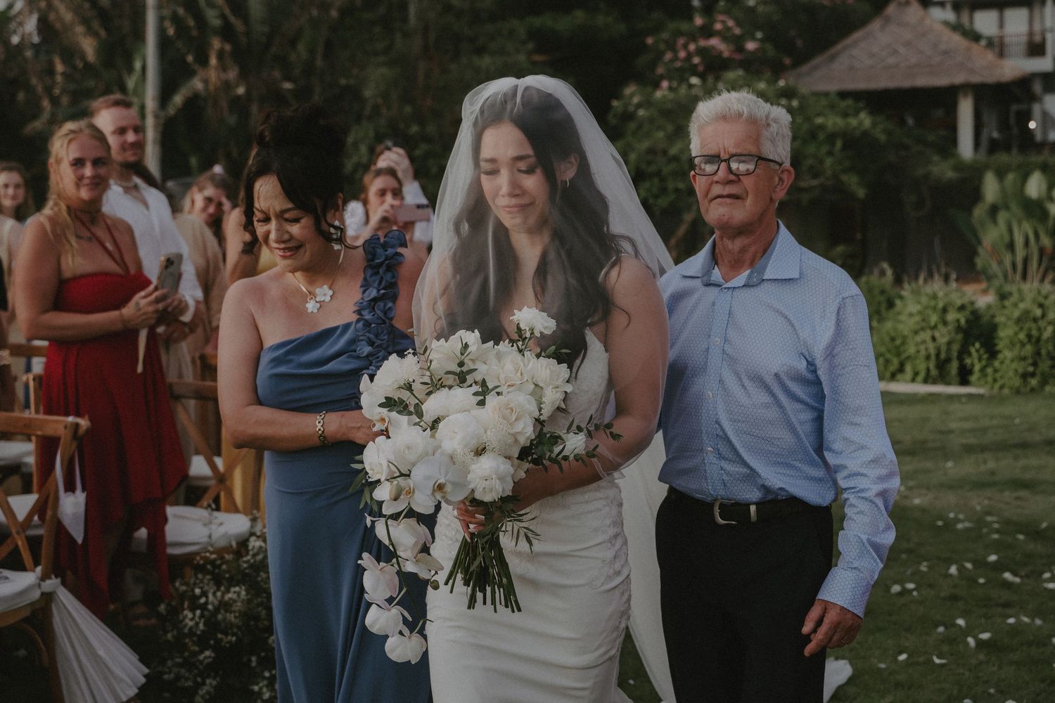 A series of outdoor wedding celebration photos showing joyful moments, dancing, and white floral bouquets in a garden setting.