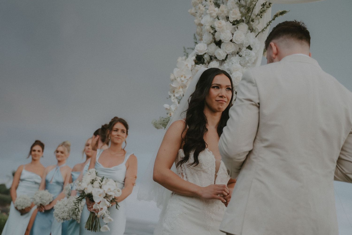 A collection of romantic outdoor wedding photos showing couples embracing during sunset and ceremony moments.