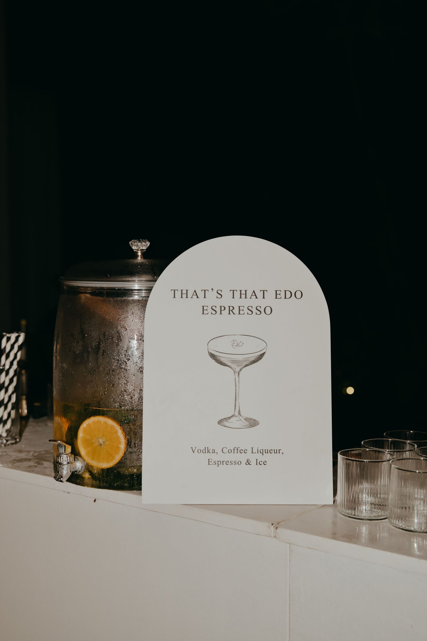 Elegant wedding bar sign for signature espresso martini cocktail with vodka, coffee liqueur, and ice.