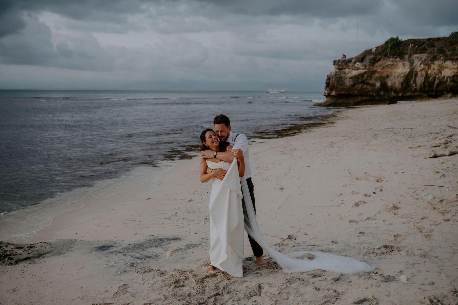 A romantic beachside photo collection with couples on a sandy shore against dramatic cloudy skies and ocean views.