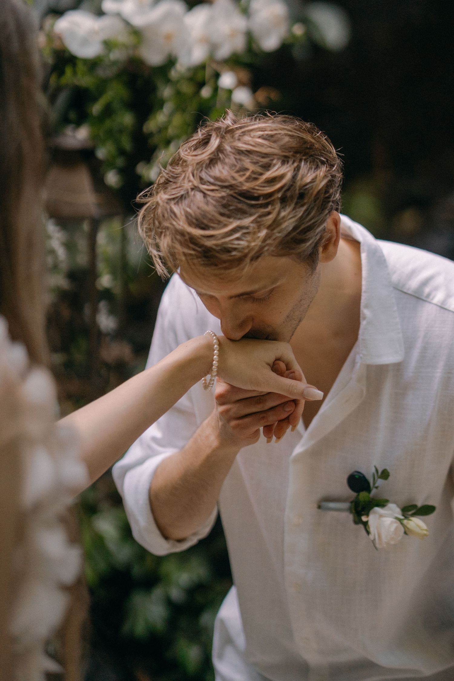 Emotional sequence showing someone in white shirt wiping tears during what appears to be a wedding ceremony.