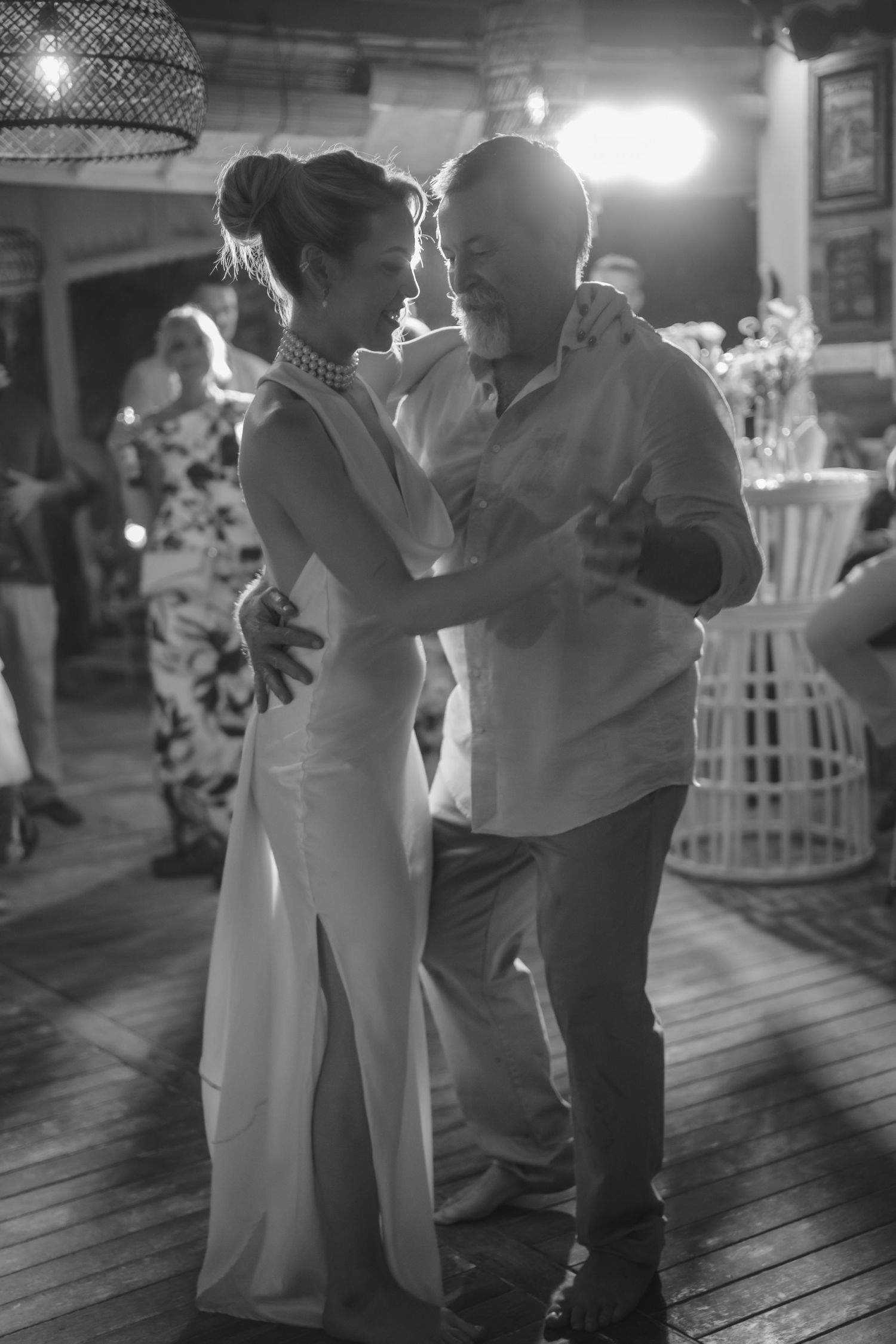 Intimate dance moment captured in black and white at wedding reception.