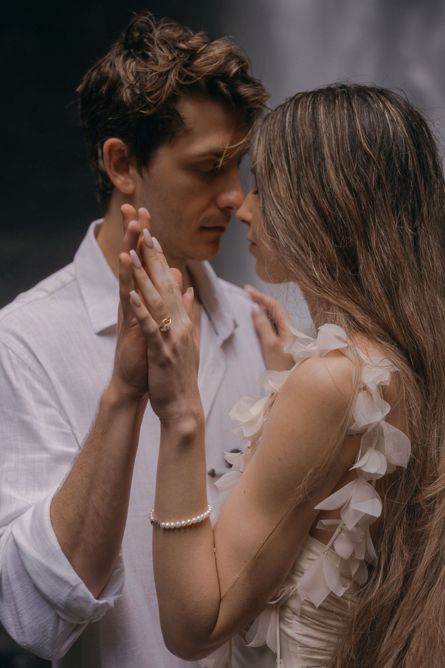 A romantic couple shares intimate moments in a series of close-up photographs showing tender expressions and gestures.