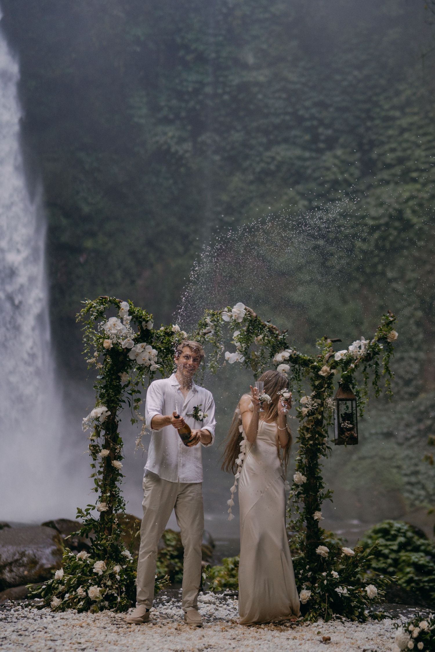 Wedding ceremony sequence with floral arch and waterfall backdrop showing progression of joyful moments.