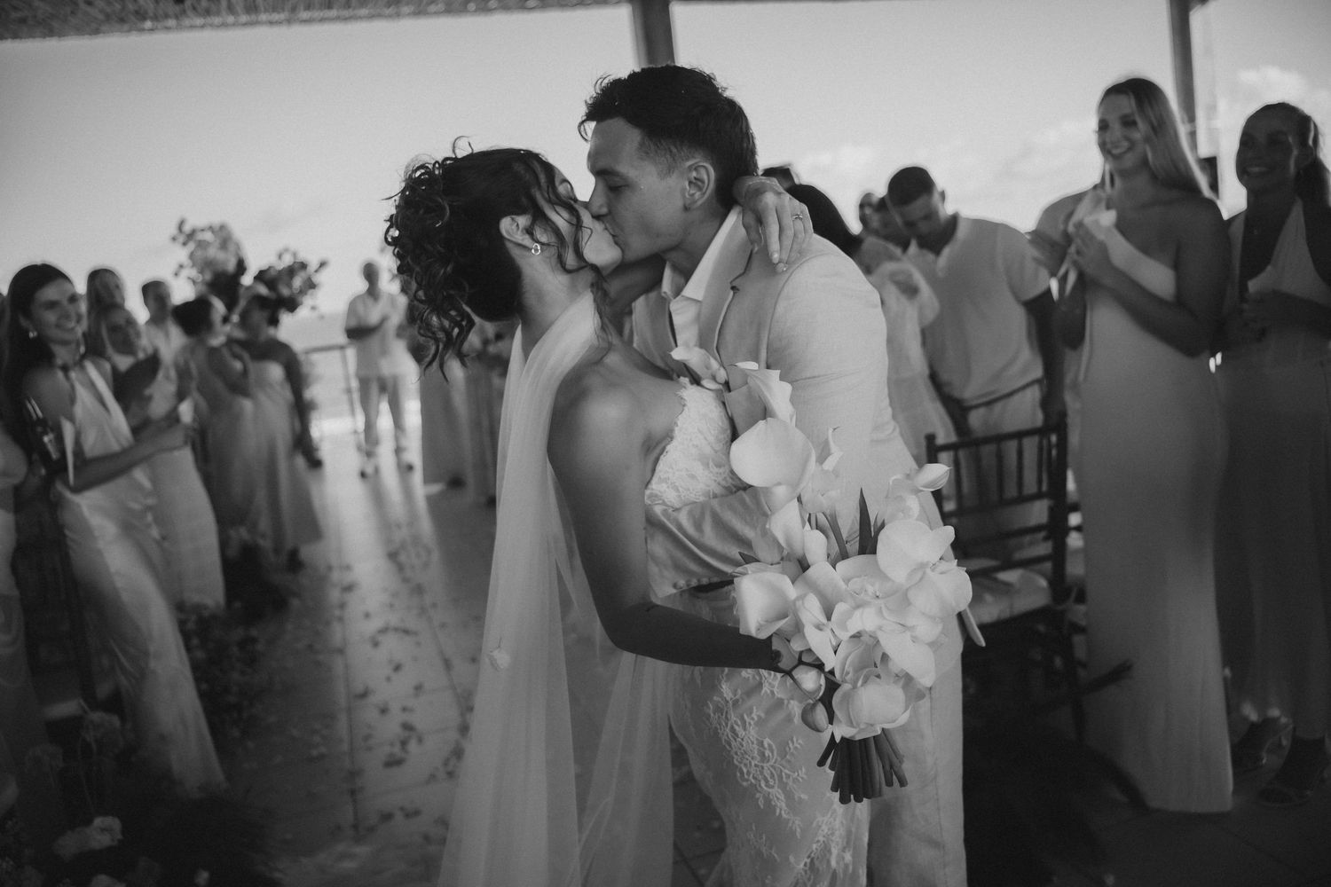 Black and white wedding reception photos showing guests celebrating.