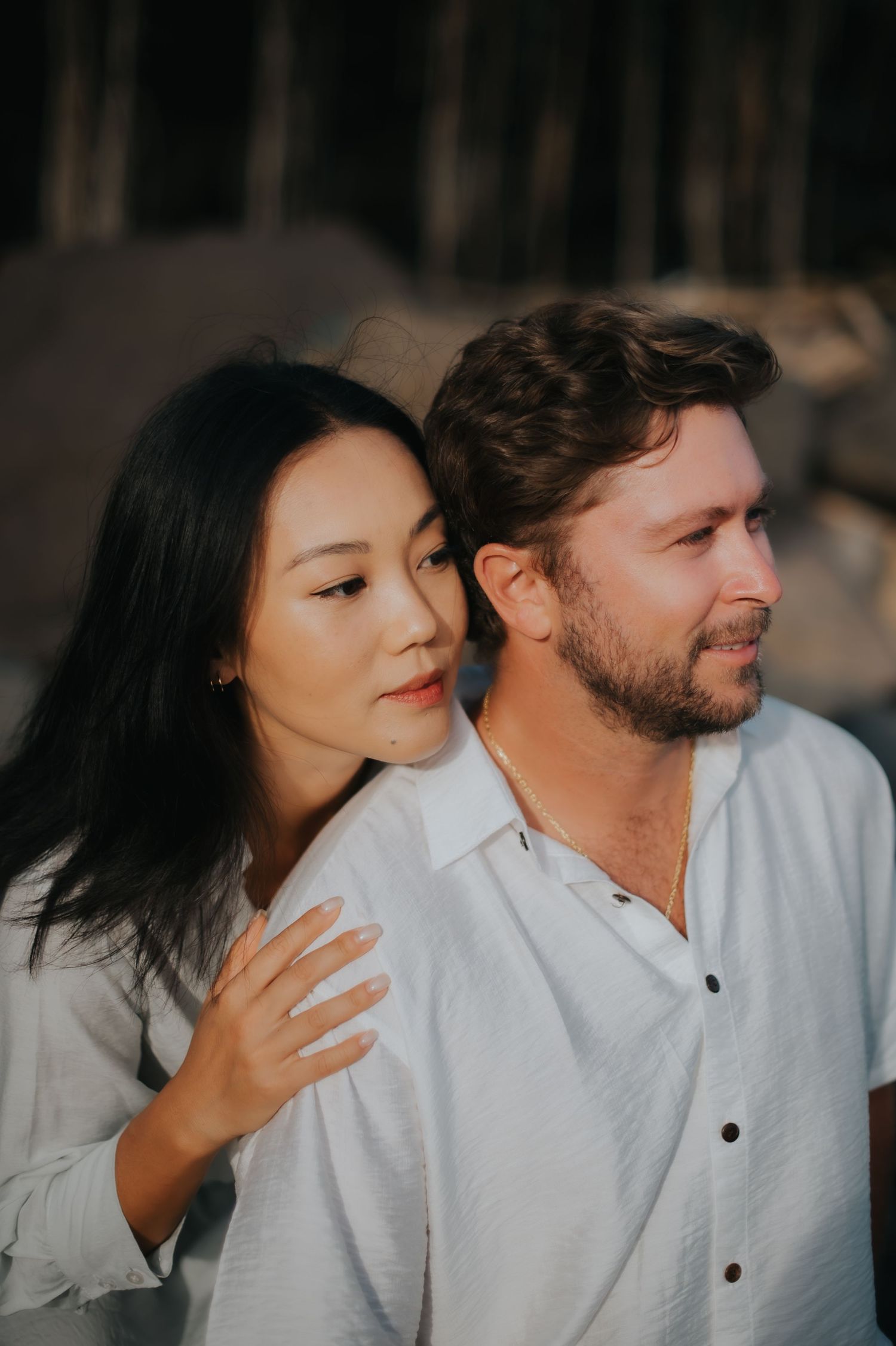 A romantic sequence of candid couple photos showing tender moments and playful interaction in natural lighting.