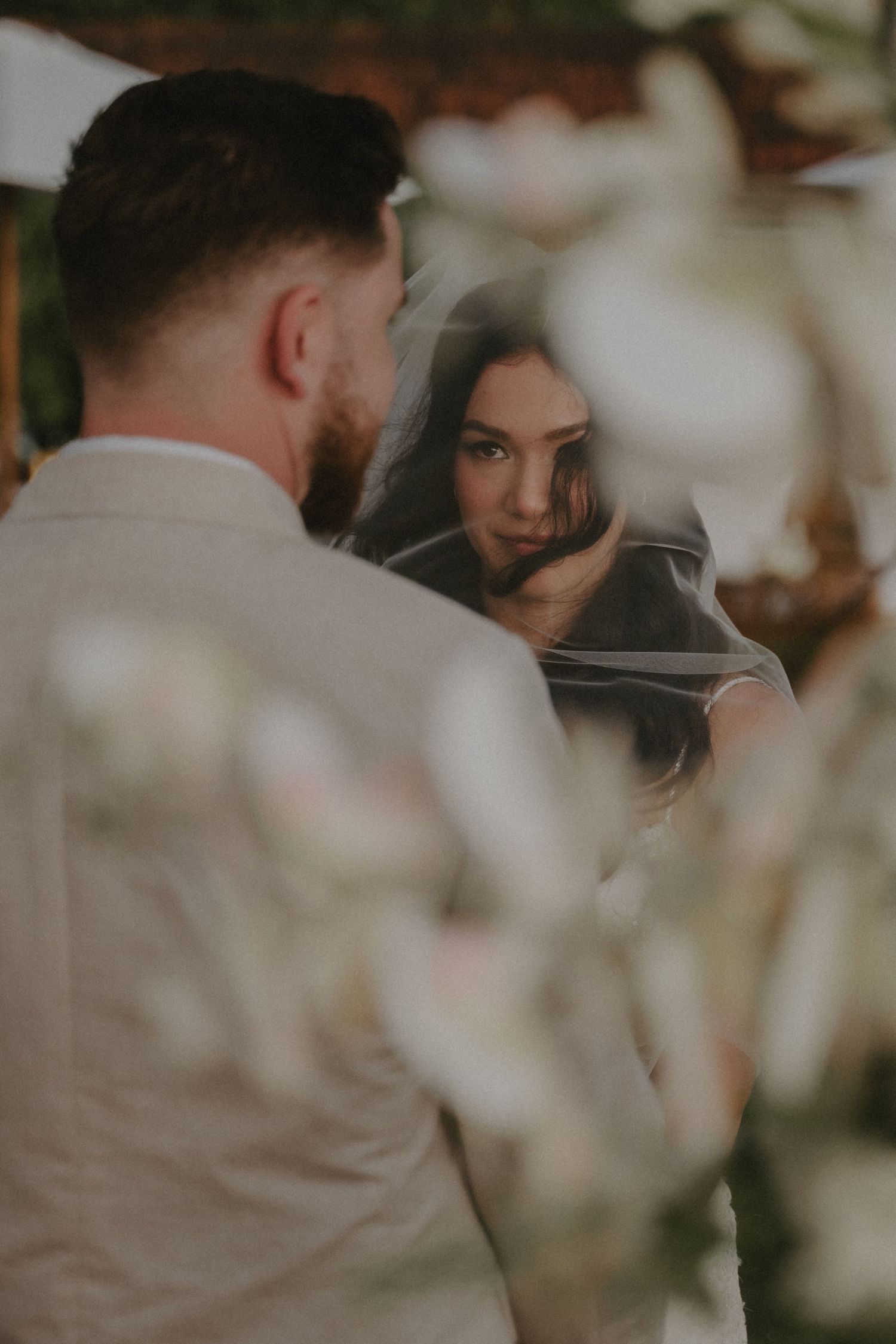A romantic wedding couple shares intimate moments in a series of soft, dreamy photographs.