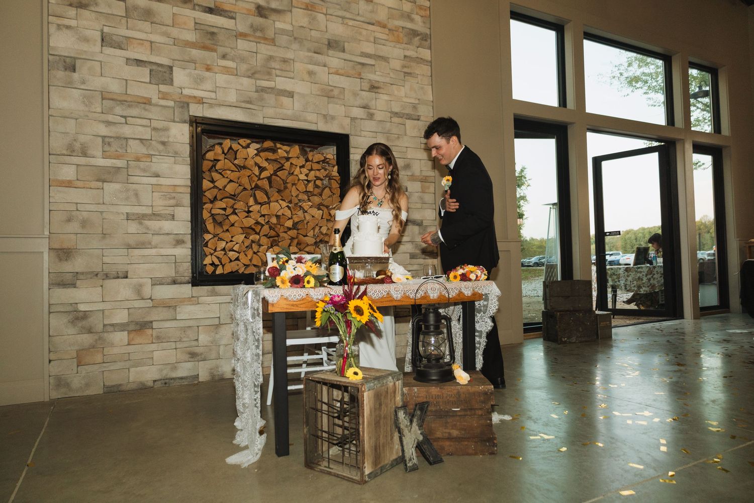 Modern stone wall interior with wooden accents and natural lighting in an elegant event space.