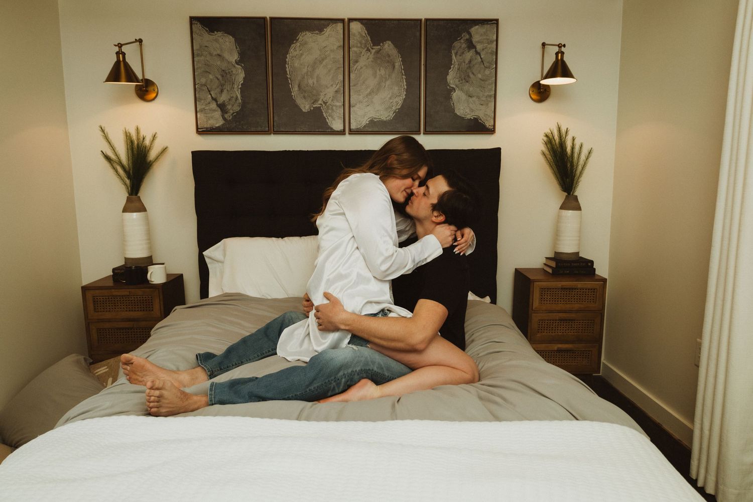 Romantic bedroom photoshoot with modern decor and abstract wall art series.