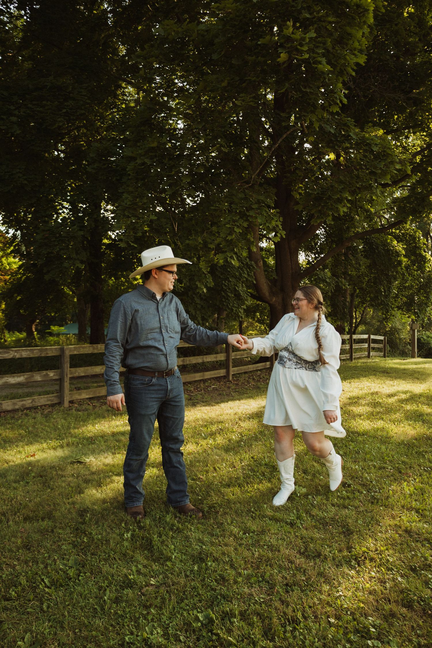 A sequence of dance moves captured in multiple frames, set in a sunlit outdoor setting with wooden fencing.