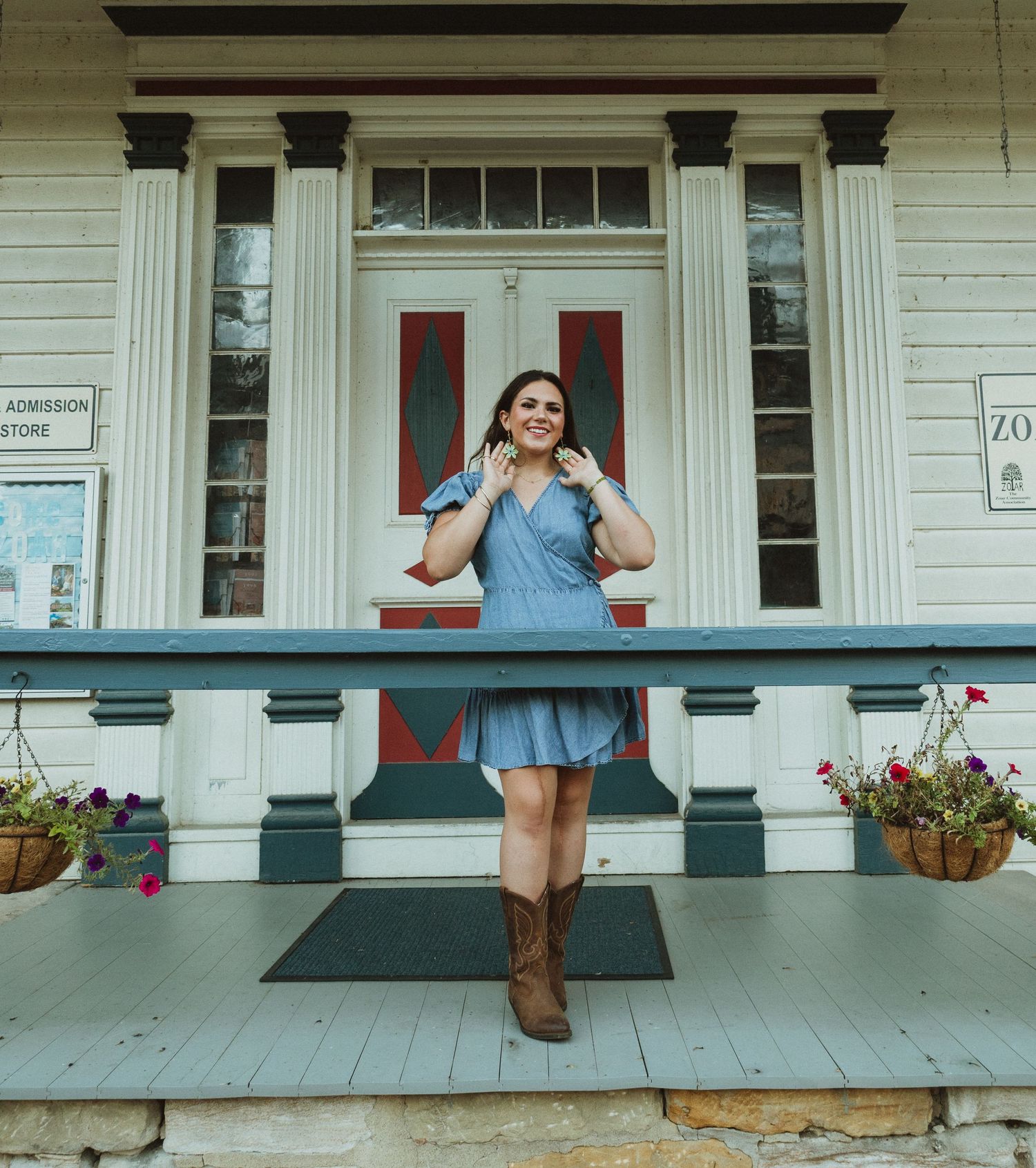 Person in blue dress poses on white porch with columns in a series of casual outdoor portraits.