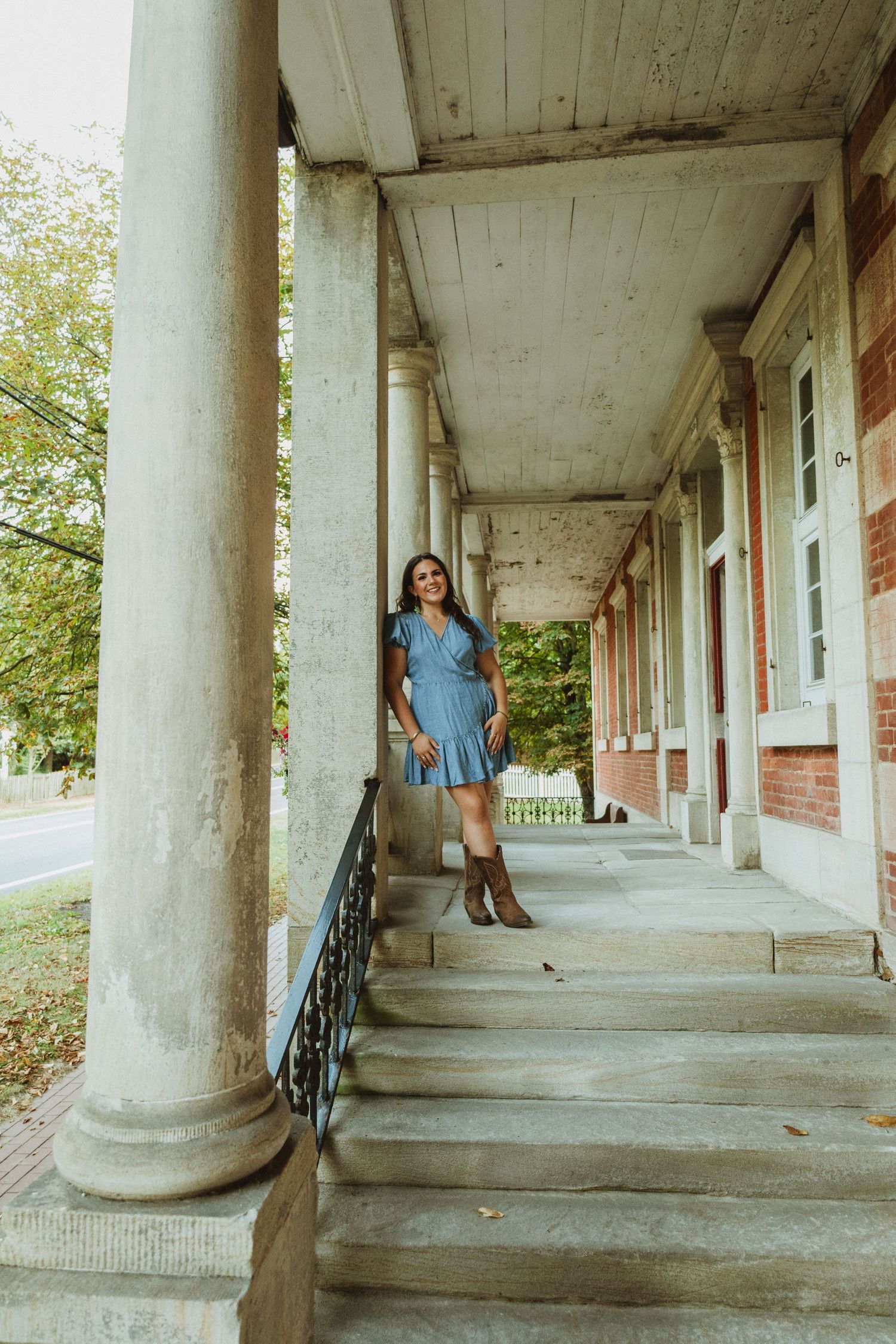 Five connected architectural images show figures in denim standing along a white columned porch with rustic details.