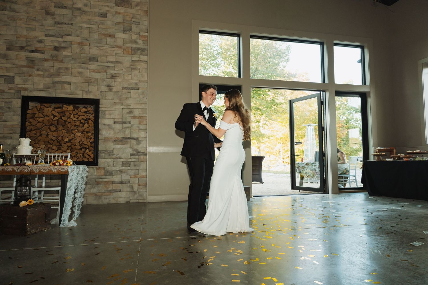 Wedding reception venue with modern stone walls and natural lighting.