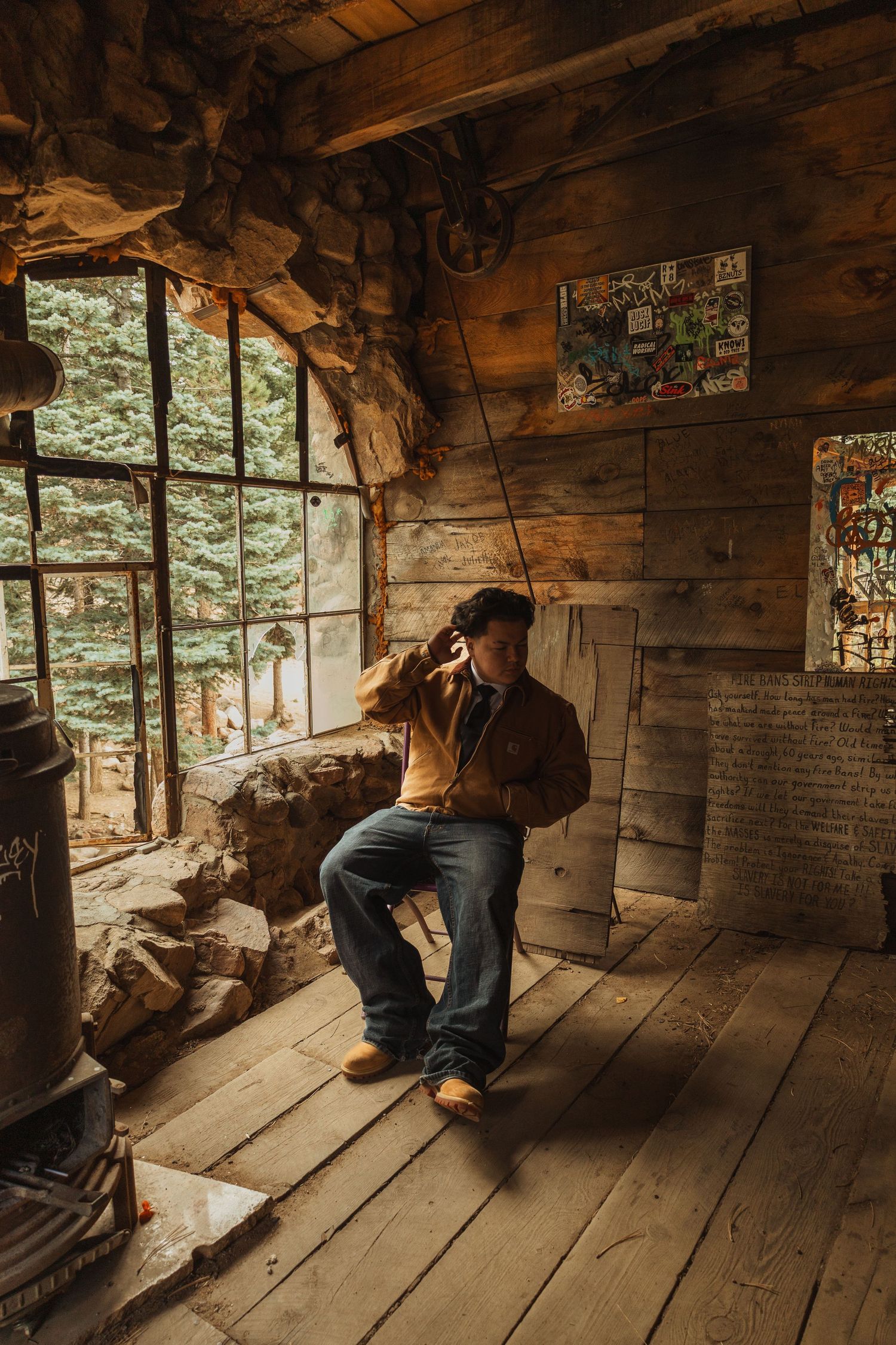 Interior shots of a rustic wooden cabin with sunlight streaming through windows.
