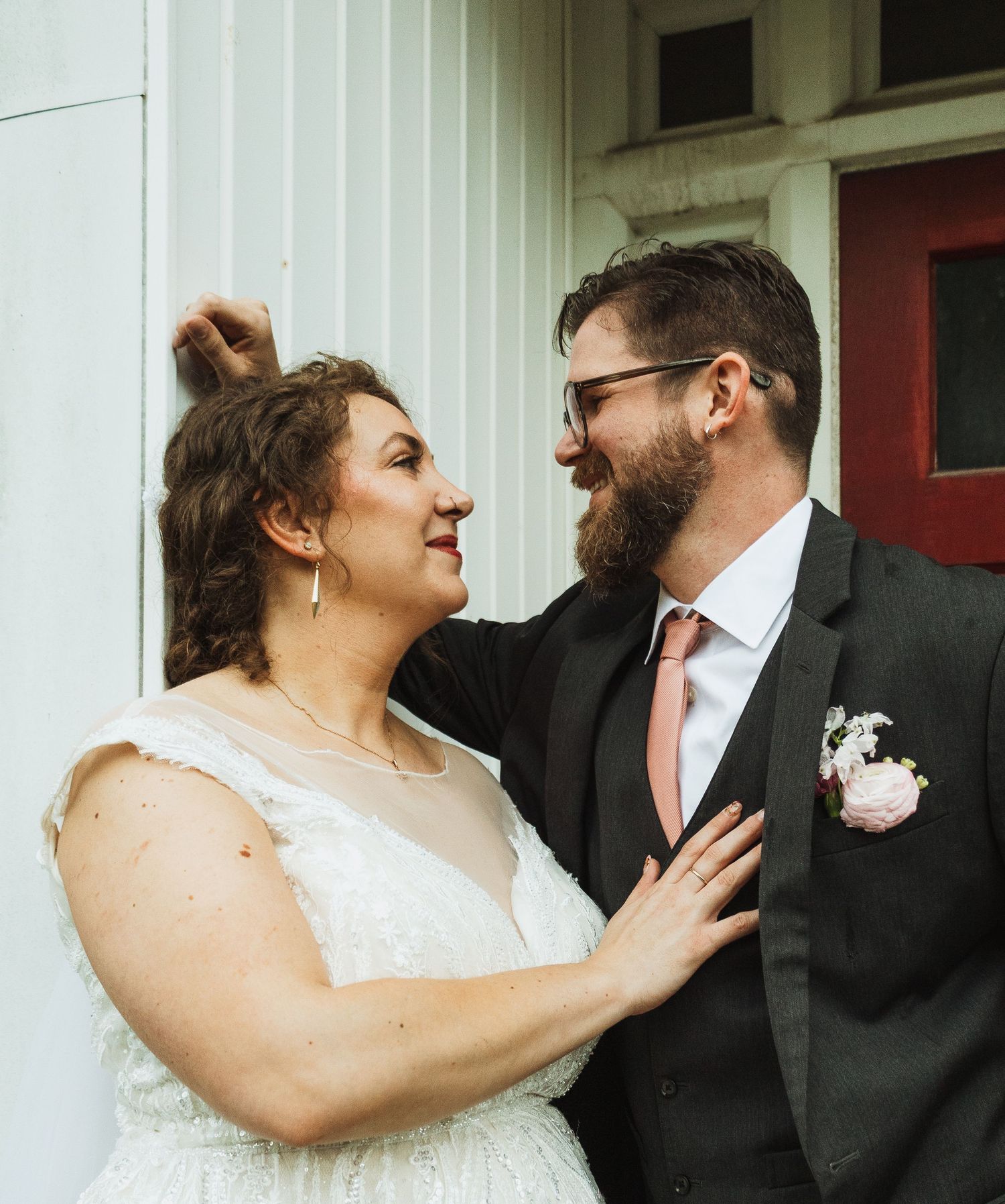 A couple in wedding attire share a series of candid moments together against a white column background.