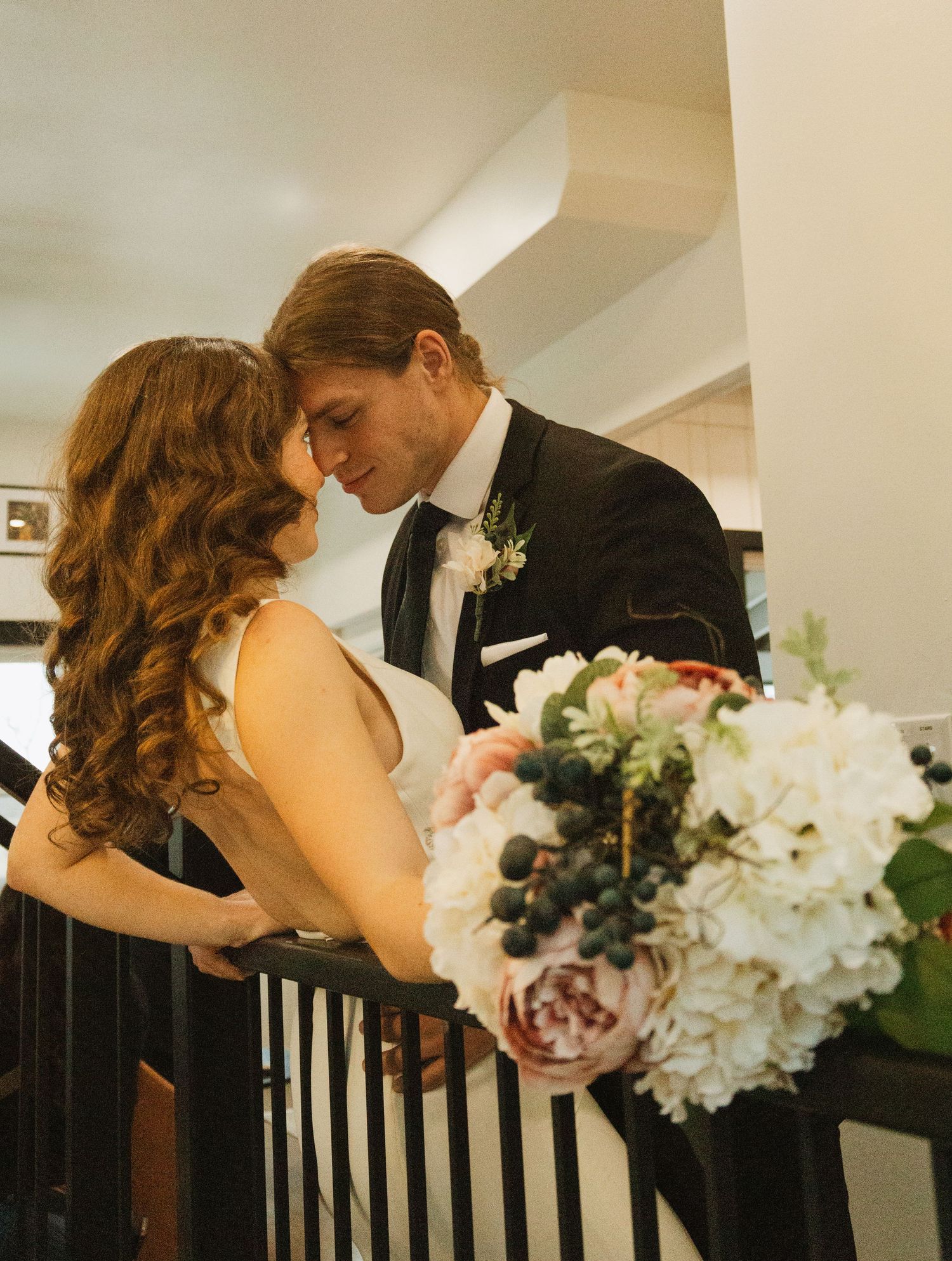 Intimate wedding moment shared in an interior setting.
