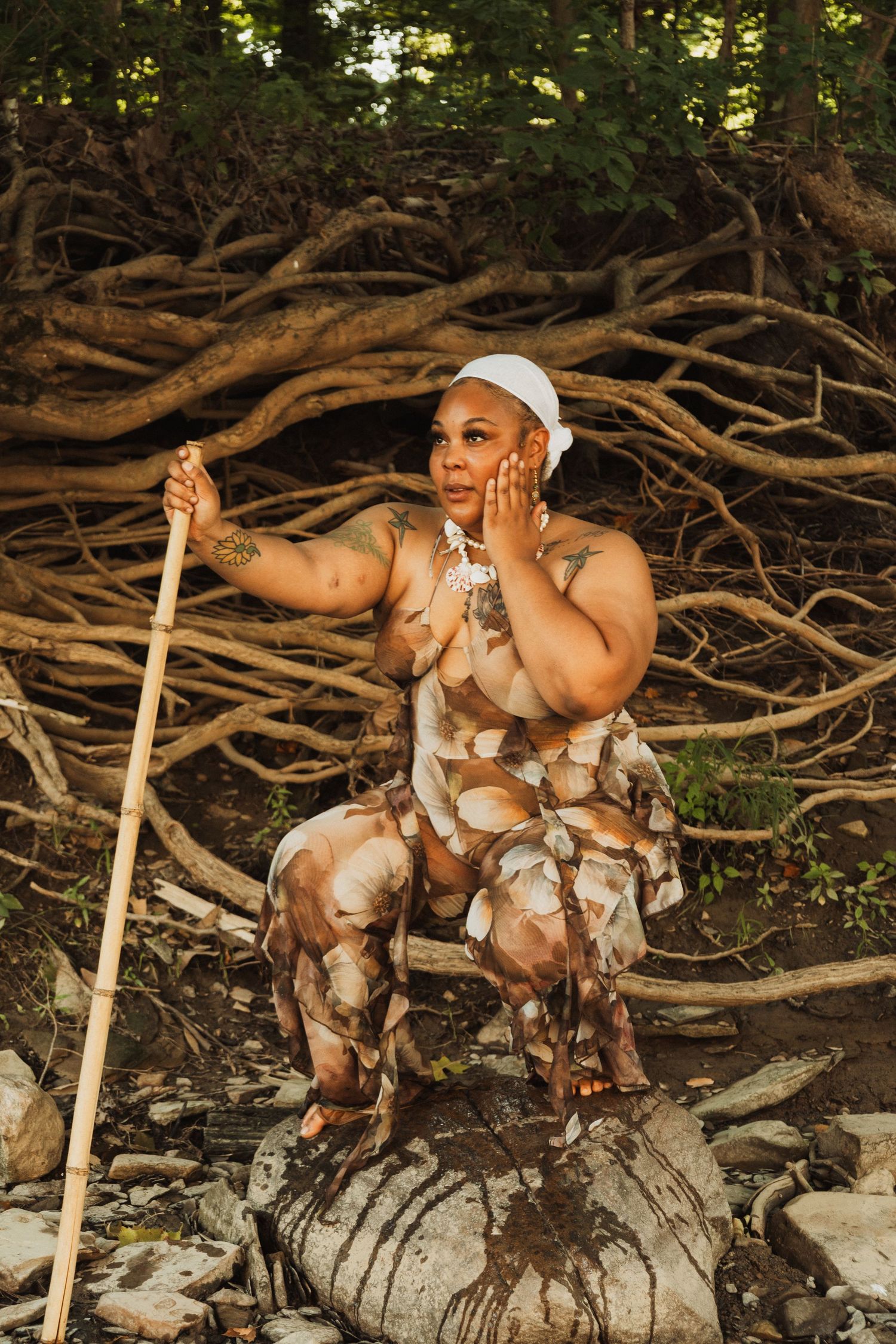 Artistic photo sequence showing figure posing on fallen logs and branches in a natural setting.