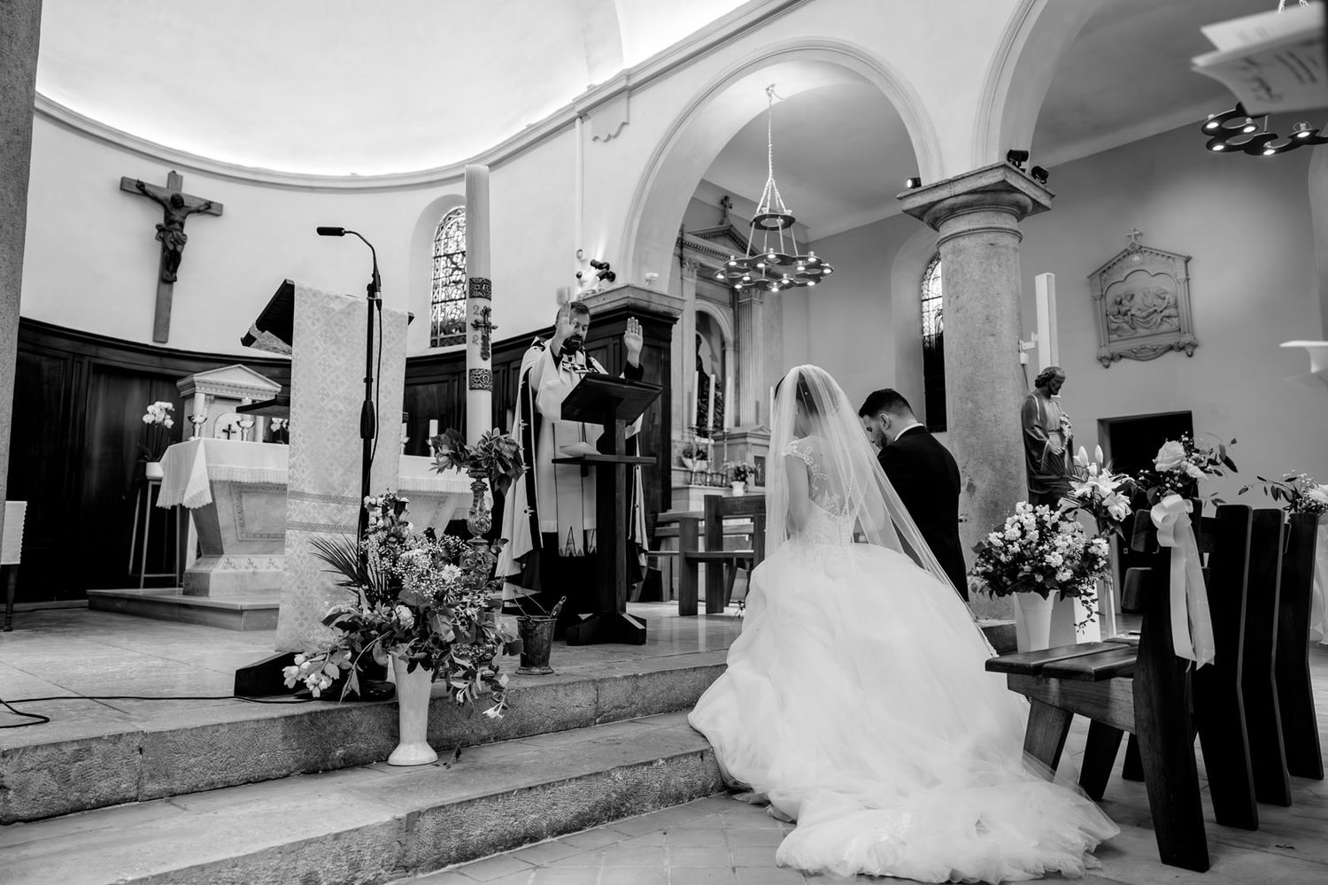 A series of black and white wedding photographs showing elegant bridal moments in a church setting.