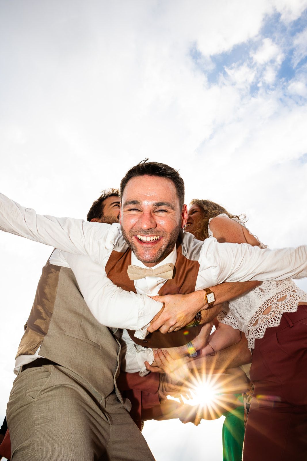 A sequence of photos showing a joyful moment between two people with sunlight peeking through between them.