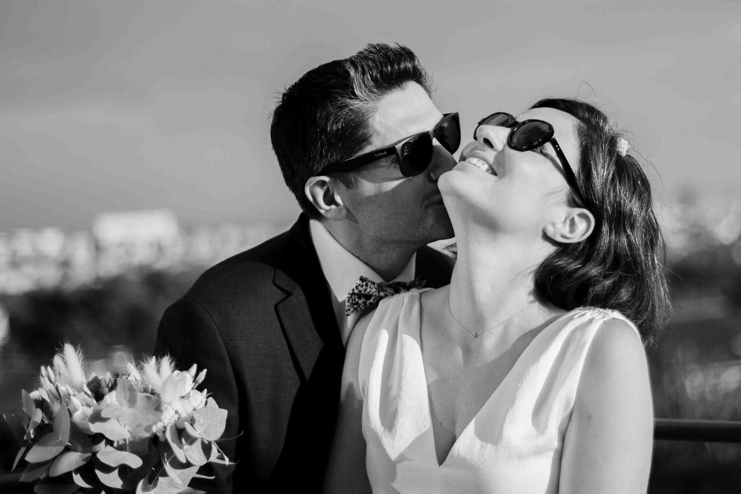 Black and white romantic wedding portrait series showing tender moments between newlyweds.