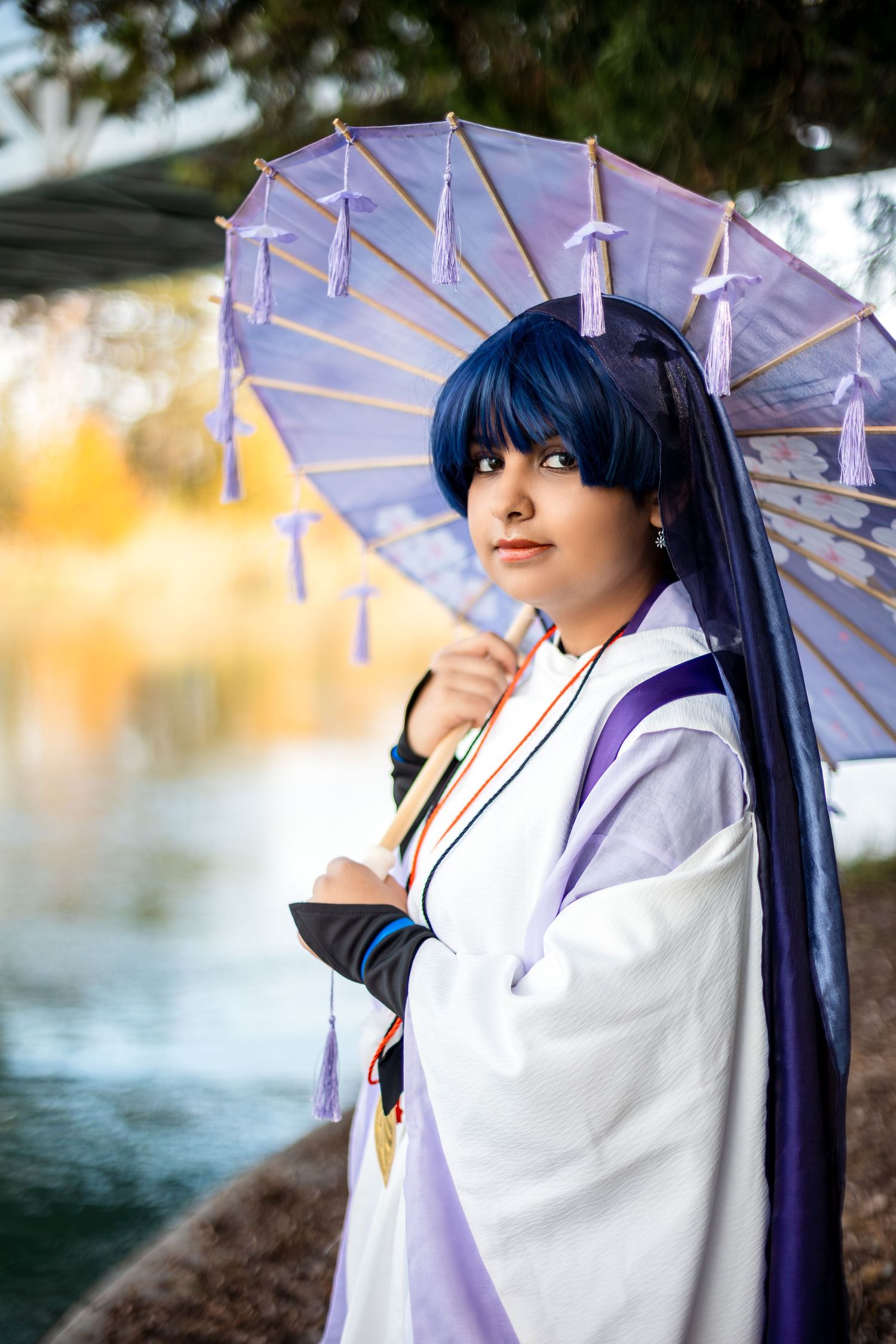 Cosplay portrait series featuring traditional Japanese-inspired costume with purple parasol by water.