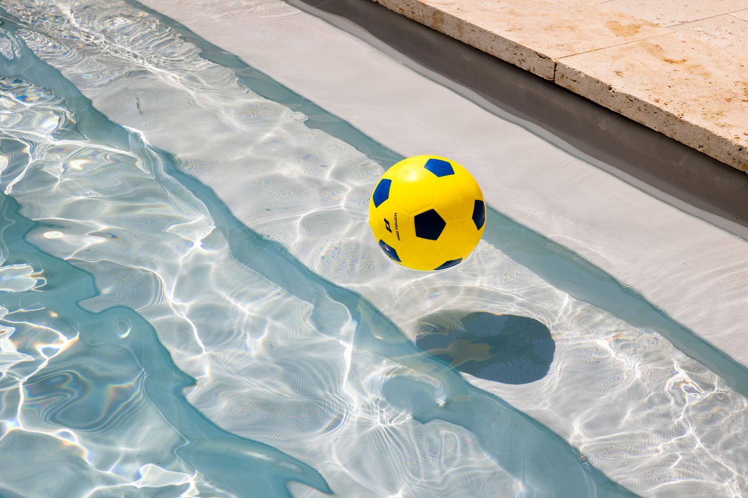 A yellow and blue beach ball floats across a sparkling swimming pool in a sequence of six connected photos.