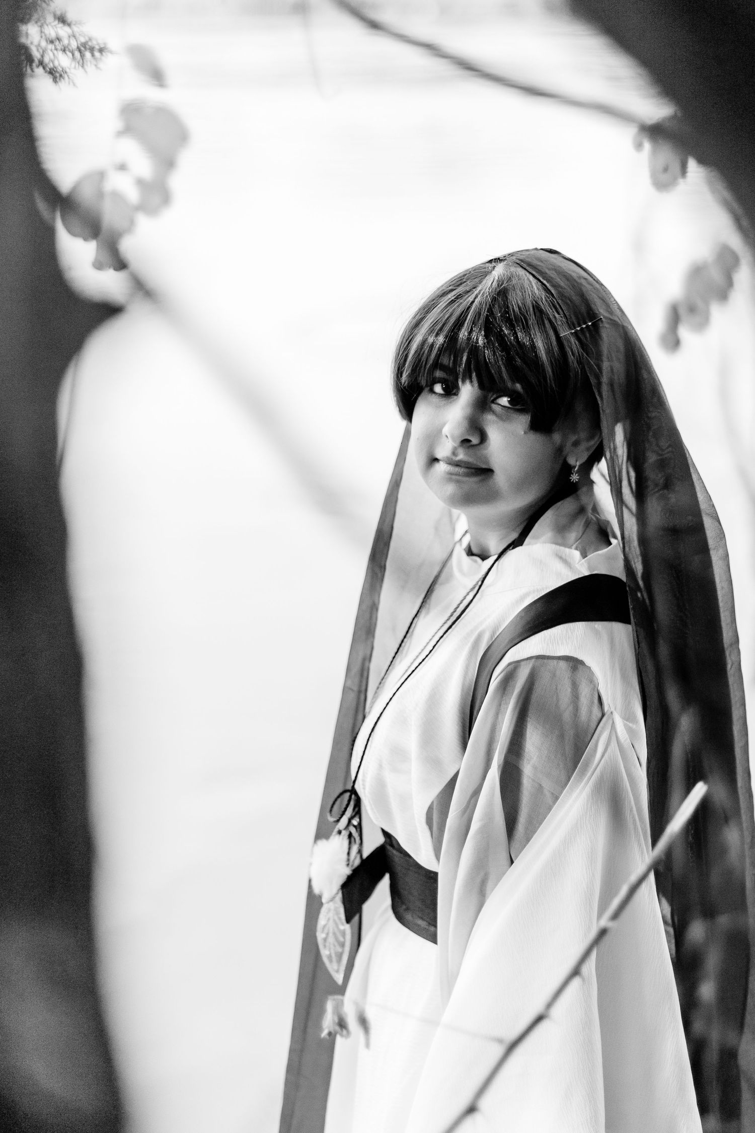 Black and white artistic portraits of cosplay character with dramatic lighting and shadows.