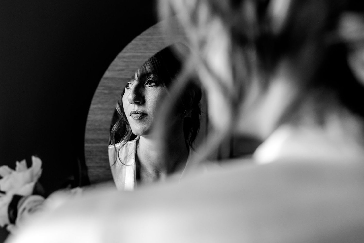 Intimate black and white portrait of wedding couple during reception.