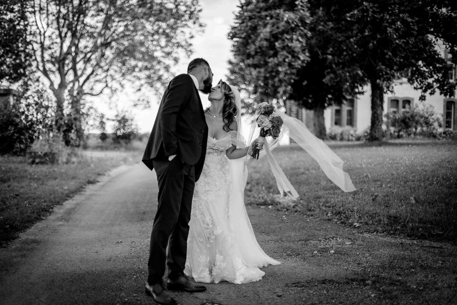 Black and white wedding photos captured in natural outdoor setting.