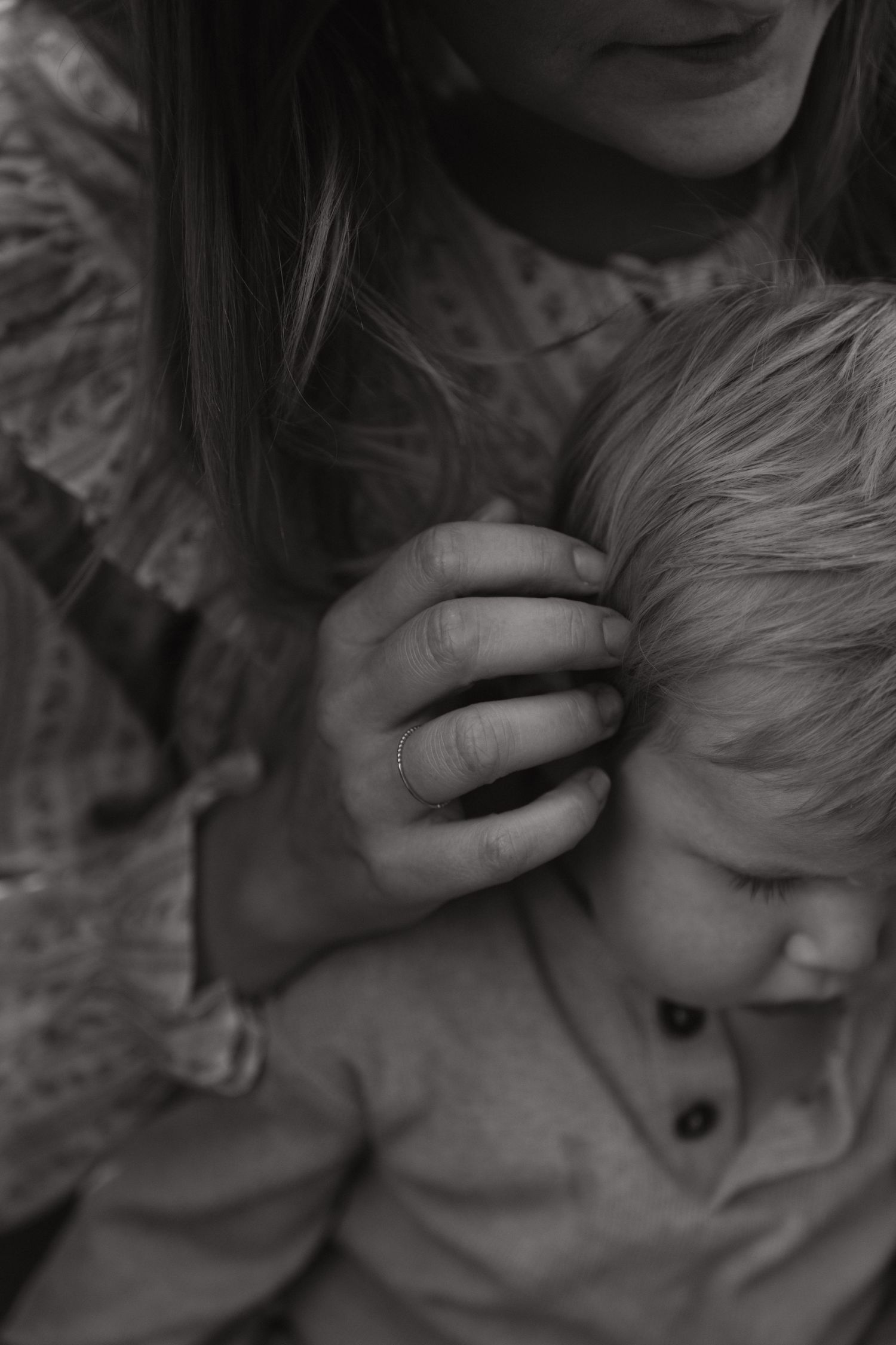 Black and white close-up shots showing gentle caressing moments.