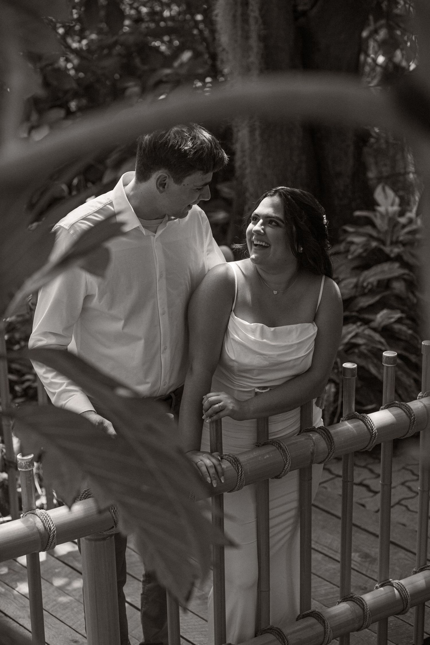 Artistic black and white photography series on a wooden balcony with natural lighting.