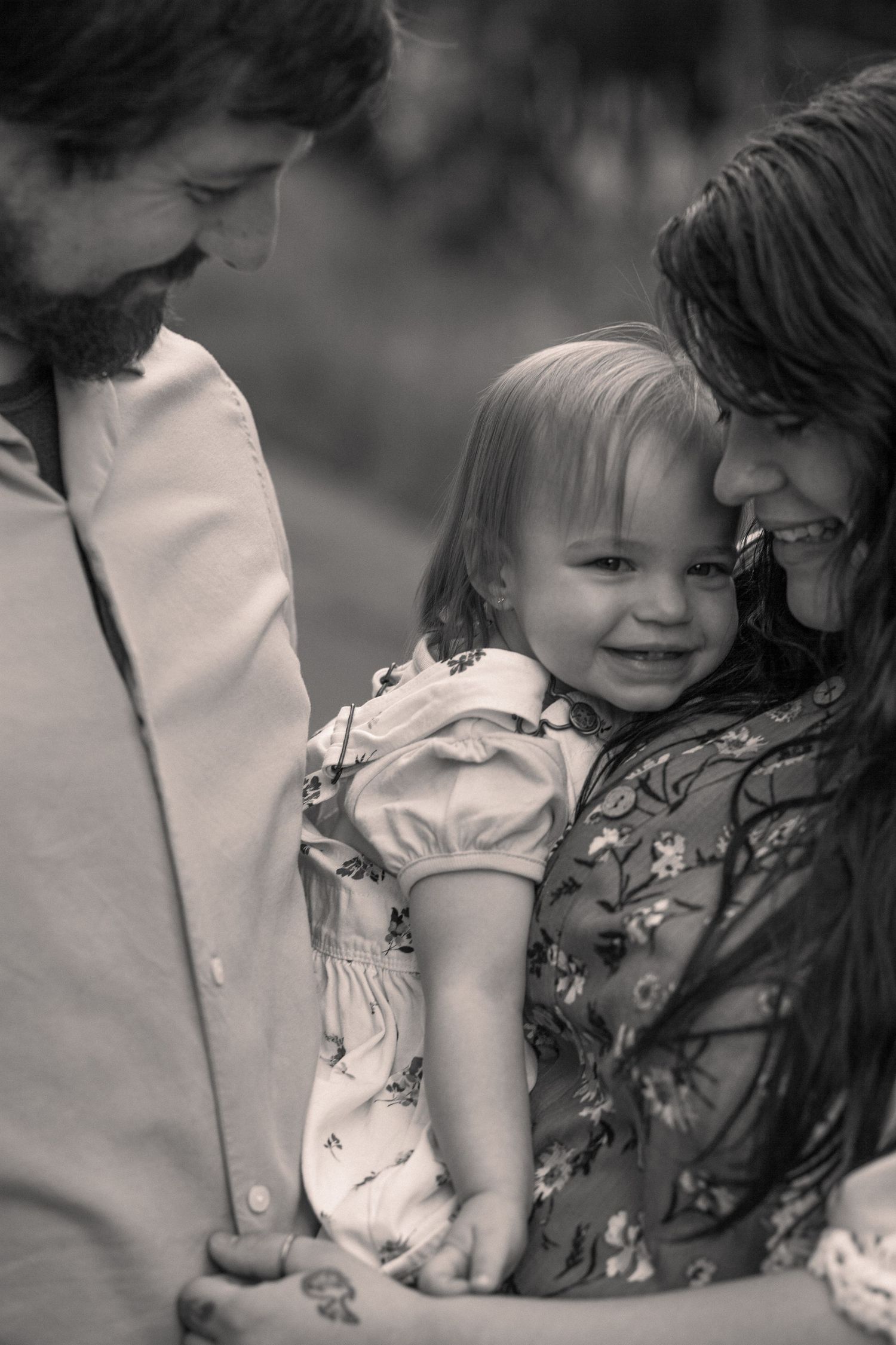 A heartwarming sequence of candid family moments showing affection and laughter outdoors.