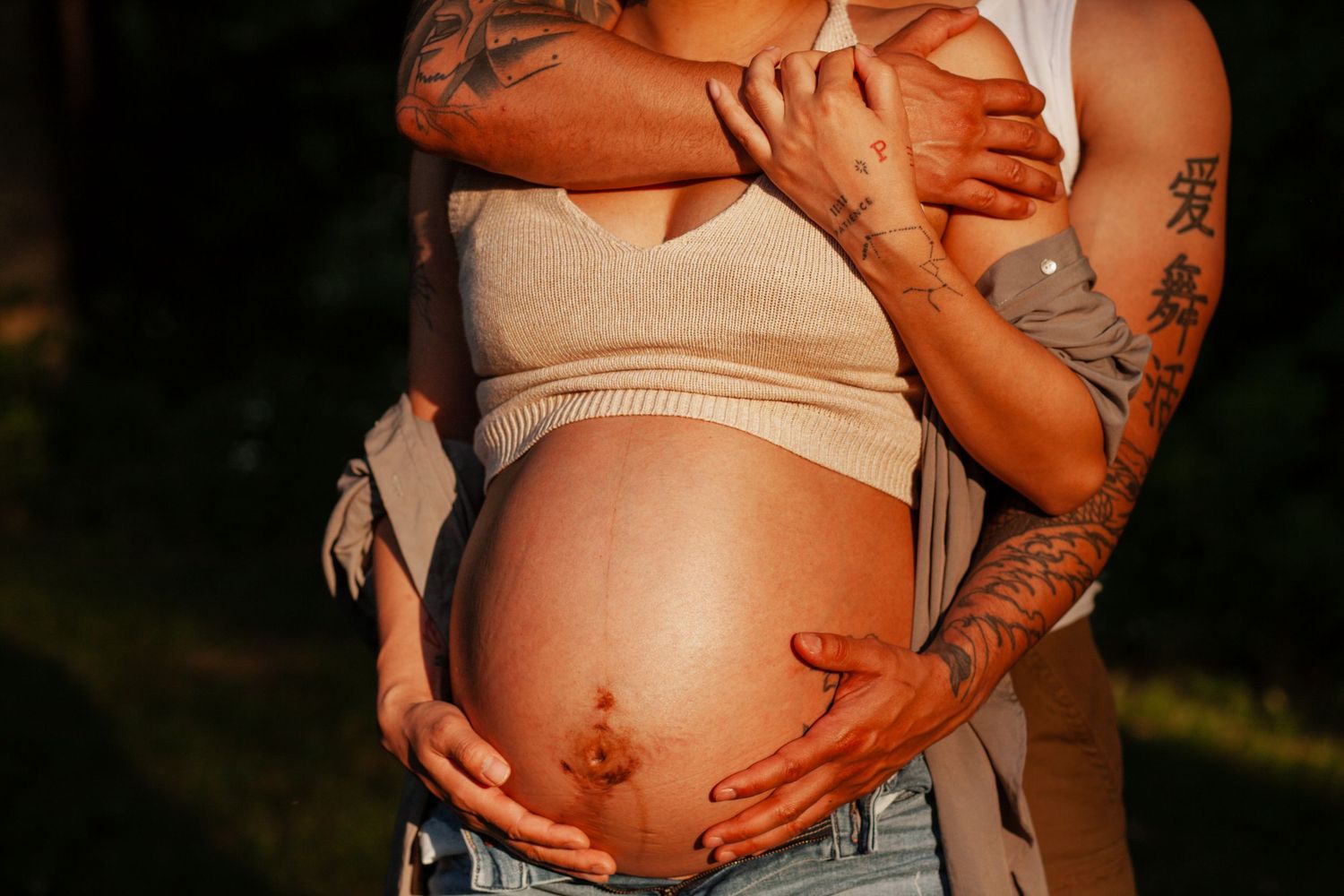 Series of intimate maternity photos showing pregnant belly with hands.