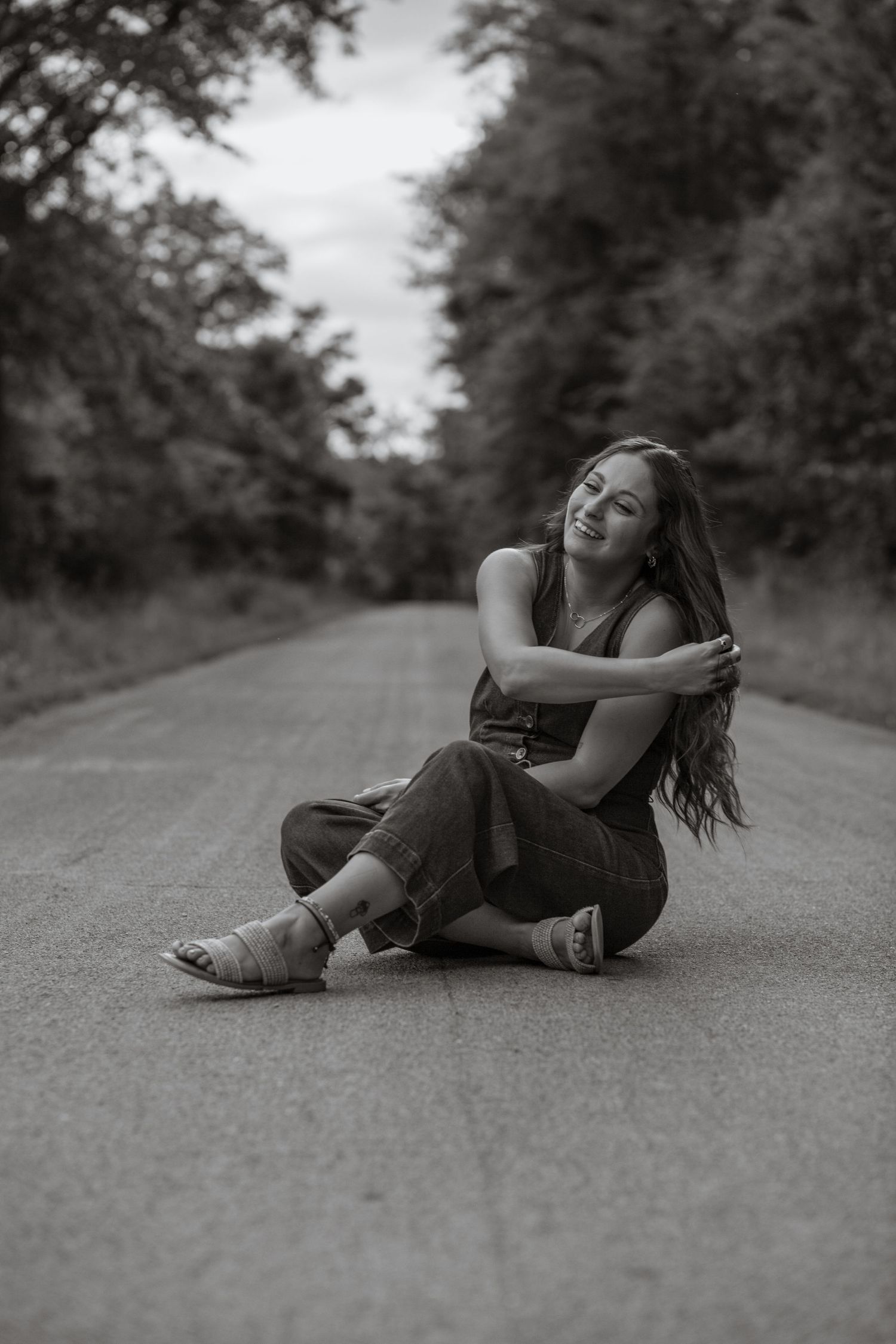Black and white photo on a rural dirt road.