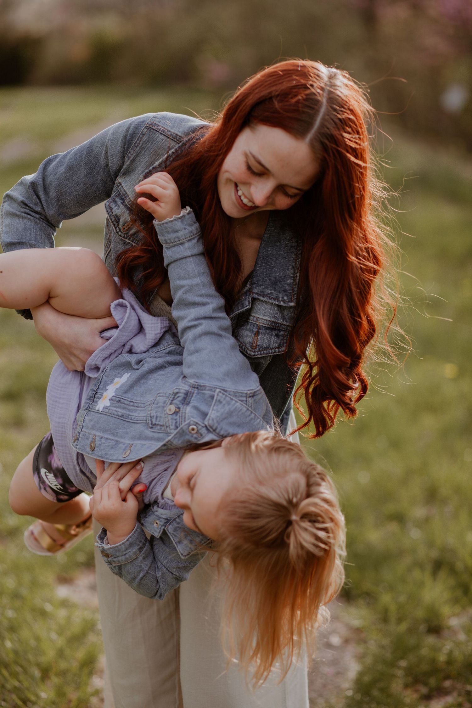 Playful moments captured in warm sunlight with denim and casual wear.