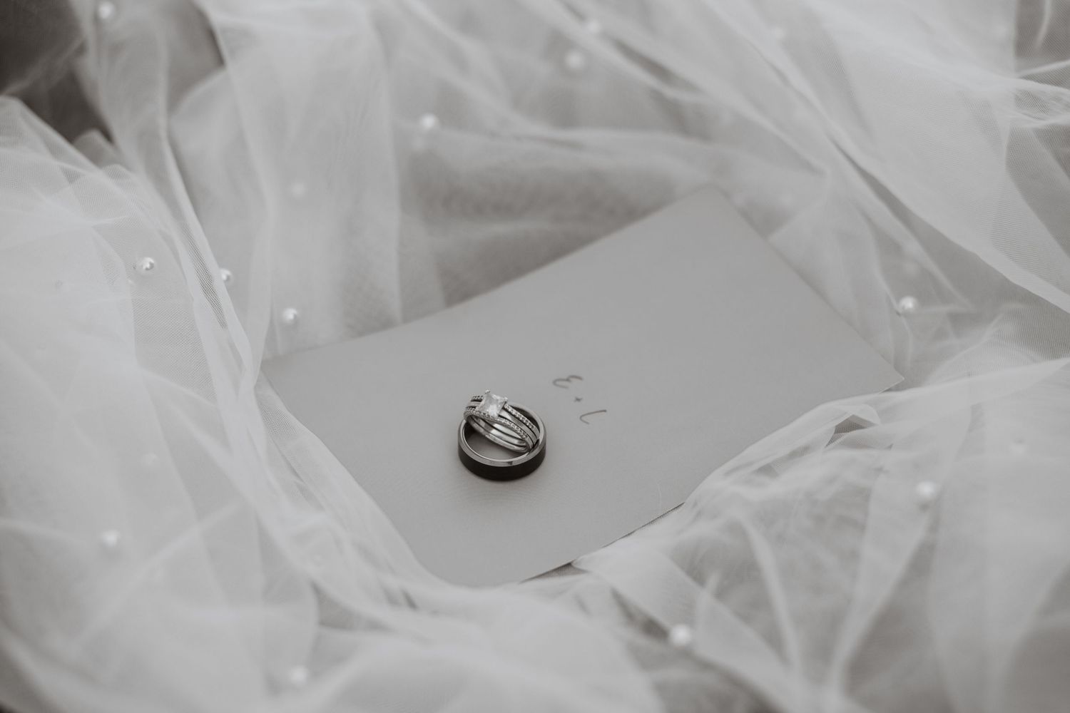Delicate white tulle fabric details in soft lighting.