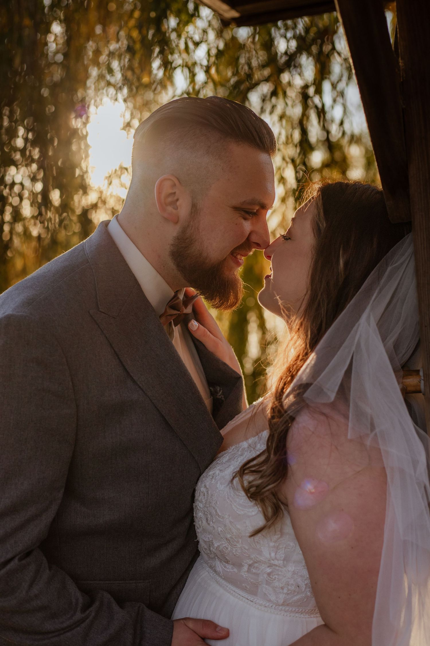 Romantic sunset wedding photo sequence showing a tender moment between newlyweds in golden light.