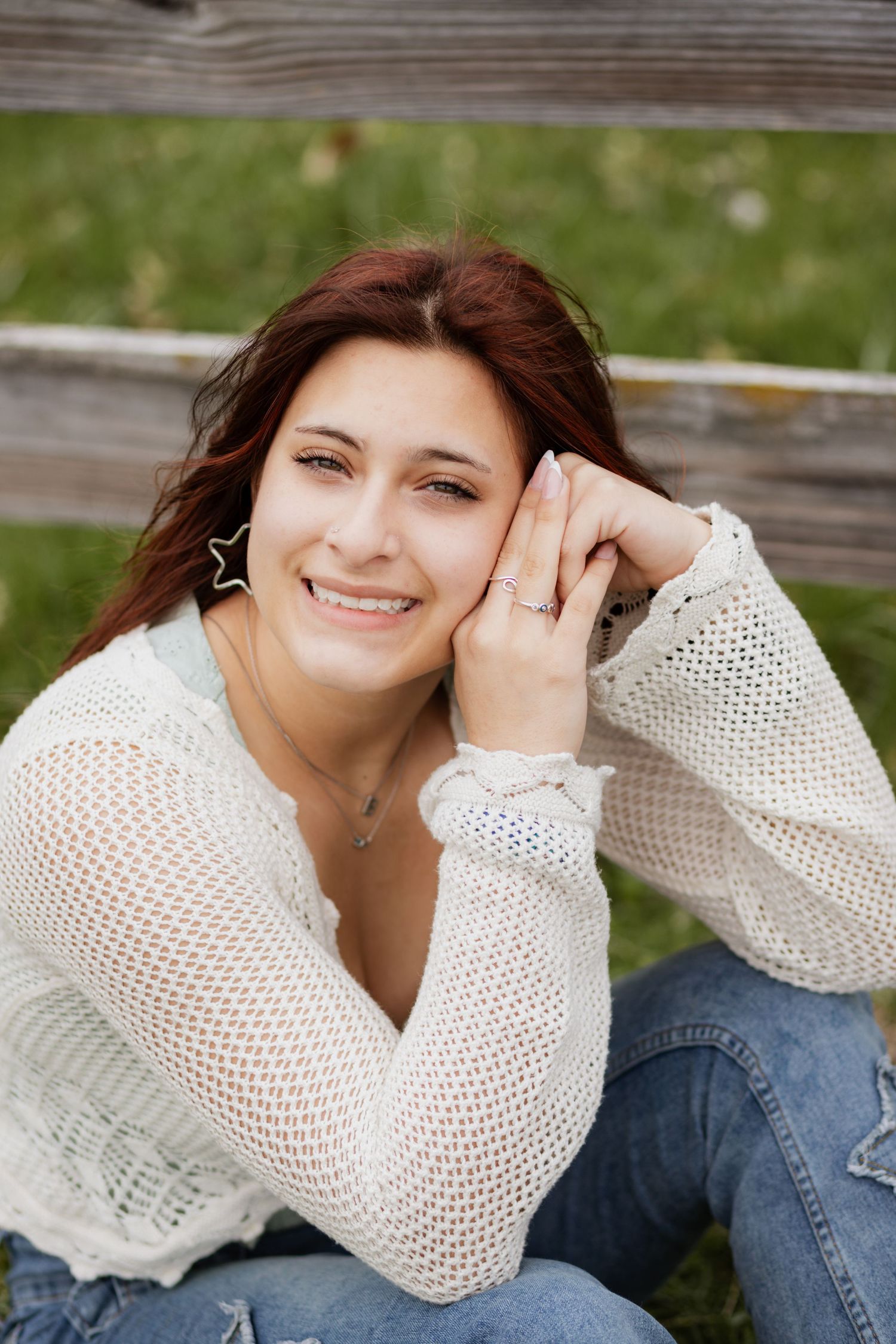 Casual portrait series showing relaxed poses against rustic wooden background.