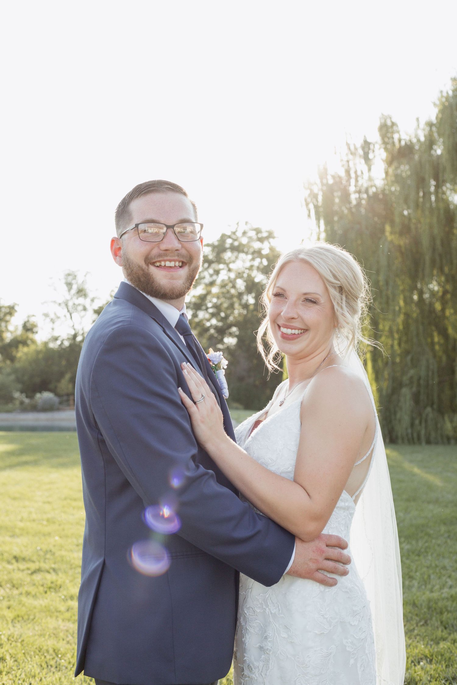 Sun-filled wedding portraits capturing joyful moments in a garden setting.