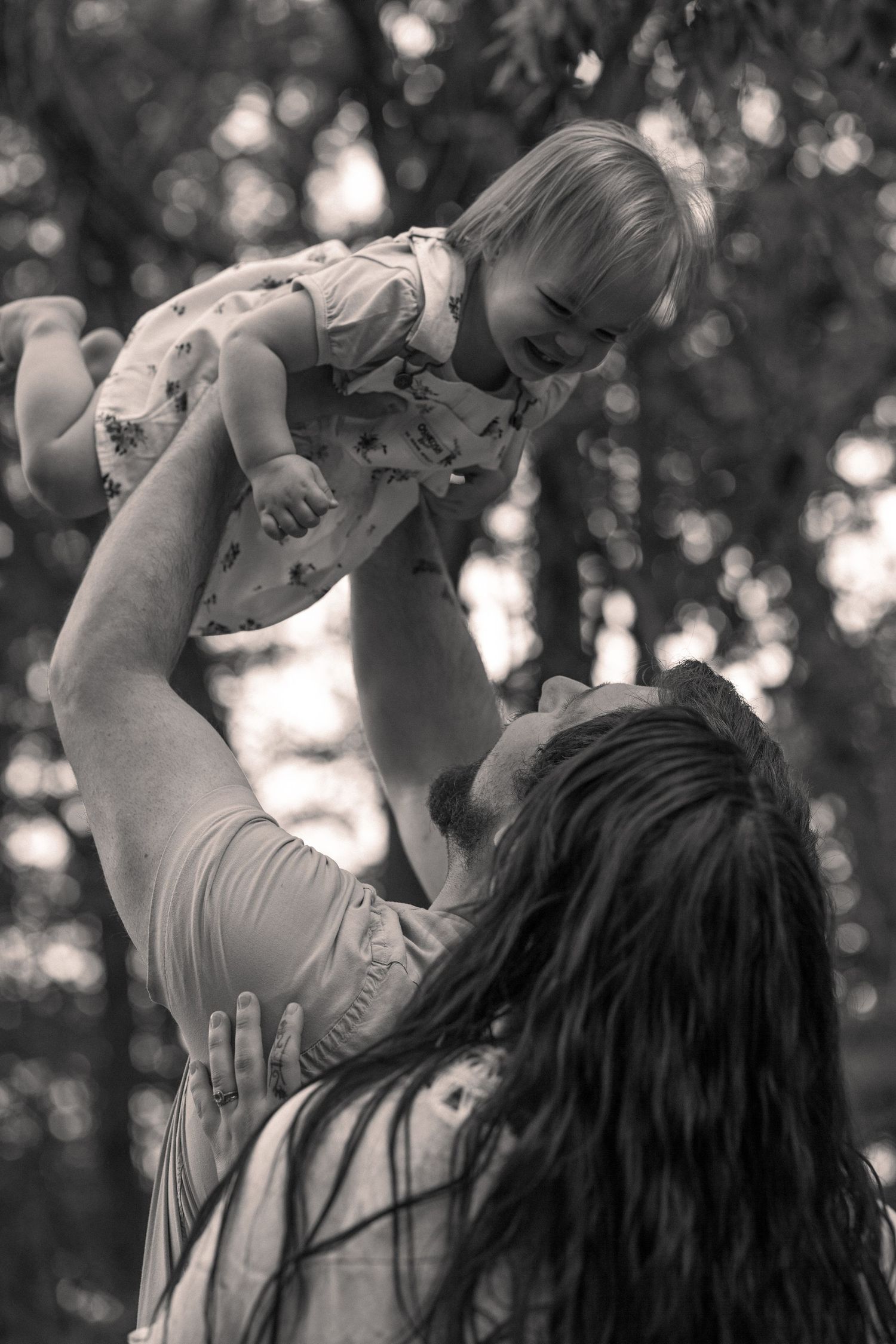 A series of joyful moments captured between parent and child playing outdoors.
