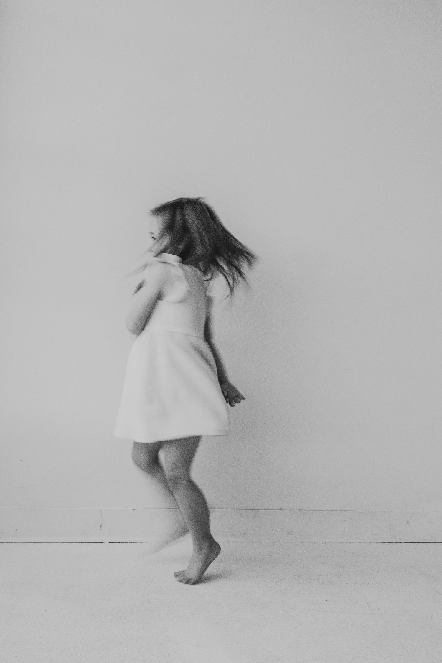 Girl dancing during a Calgary Mini Session at Studio Boheme. Calgary family photography.