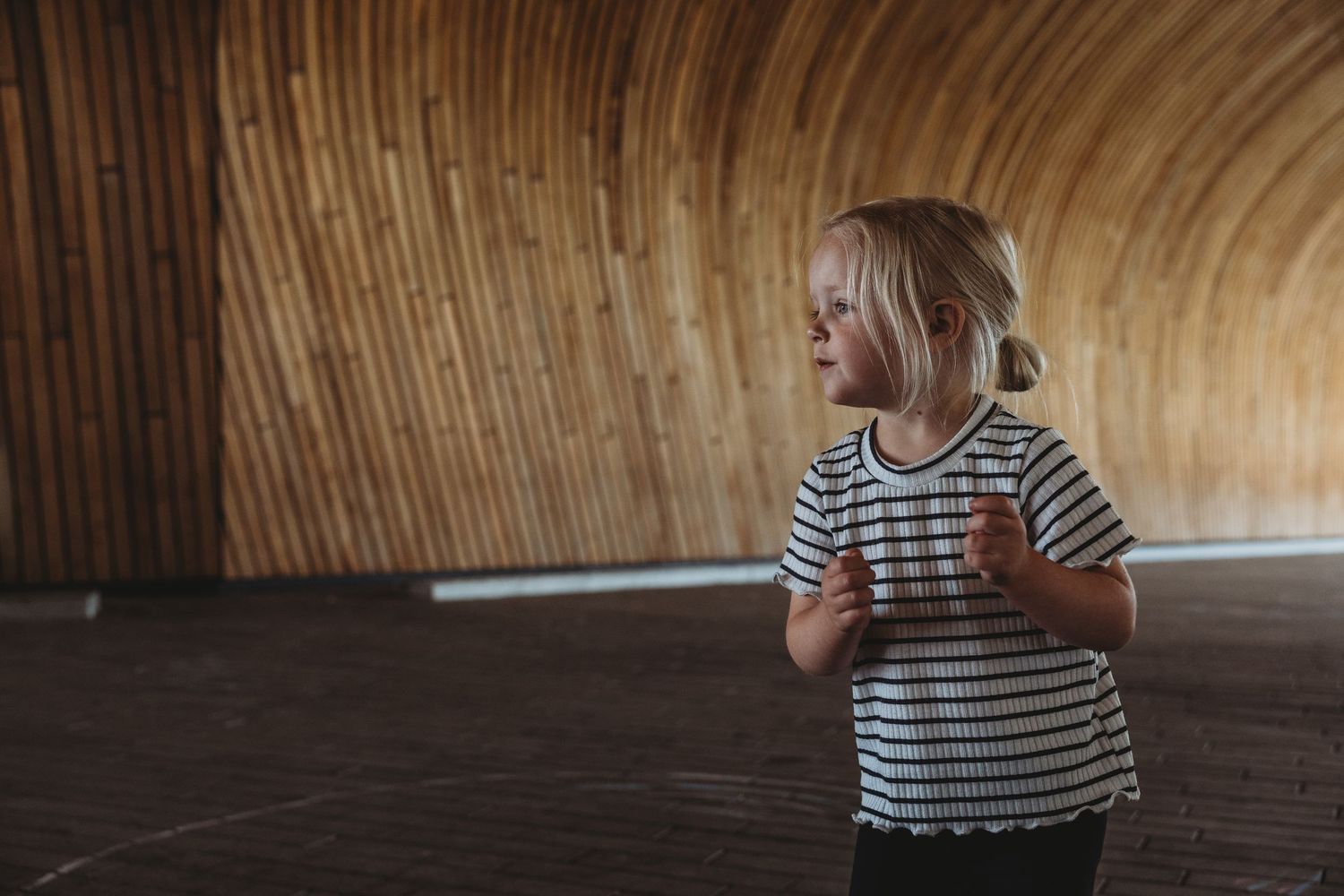 Girl in a Calgary family photography session at the entrance of the Central Calgary Public Library