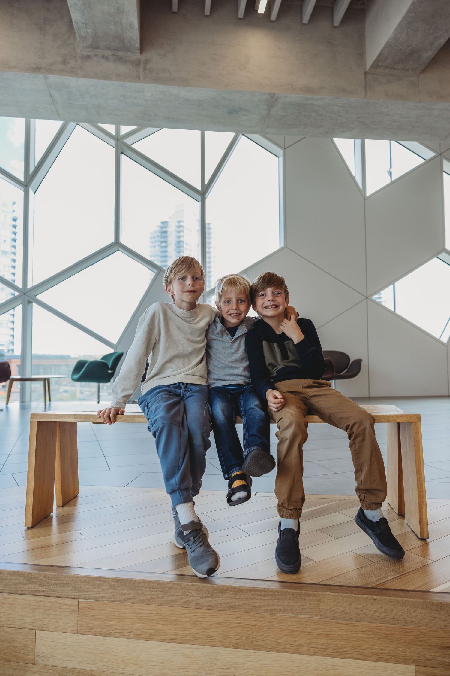 Family photo of brothers in a Calgary family photography session at the Central Calgary Public Library.