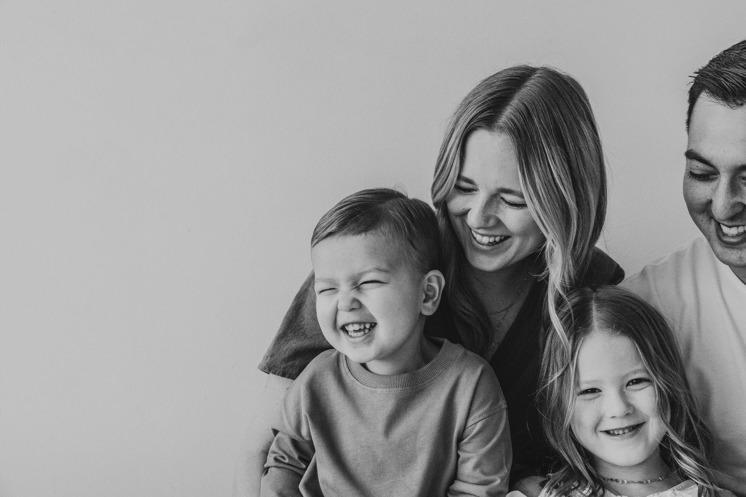 Mom and son laughing during a Calgary Mini Session at Studio Boheme. Calgary family photography.