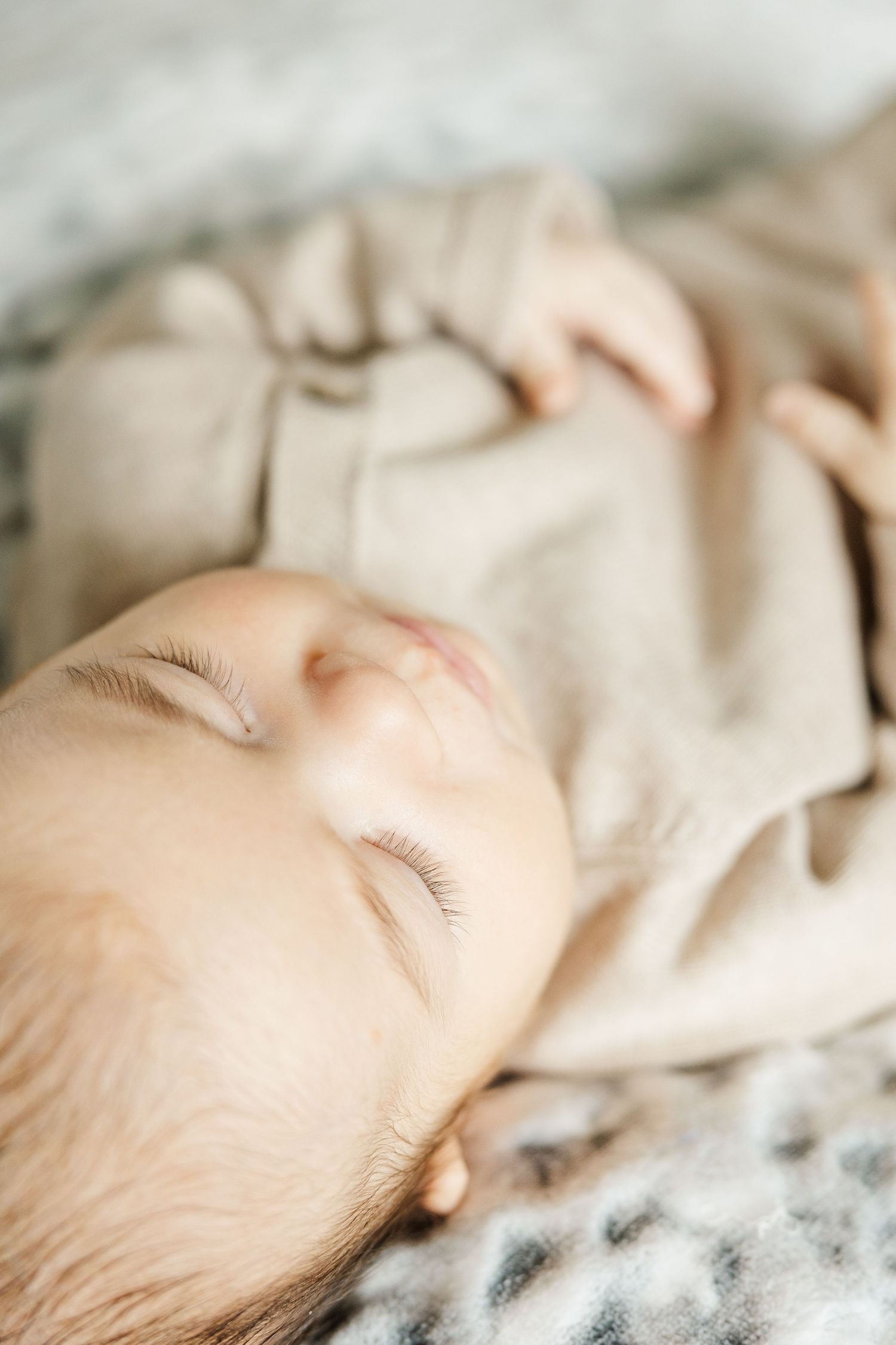Close-up of a peacefully sleeping newborn during an in-home lifestyle newborn session in Palatine Illinois